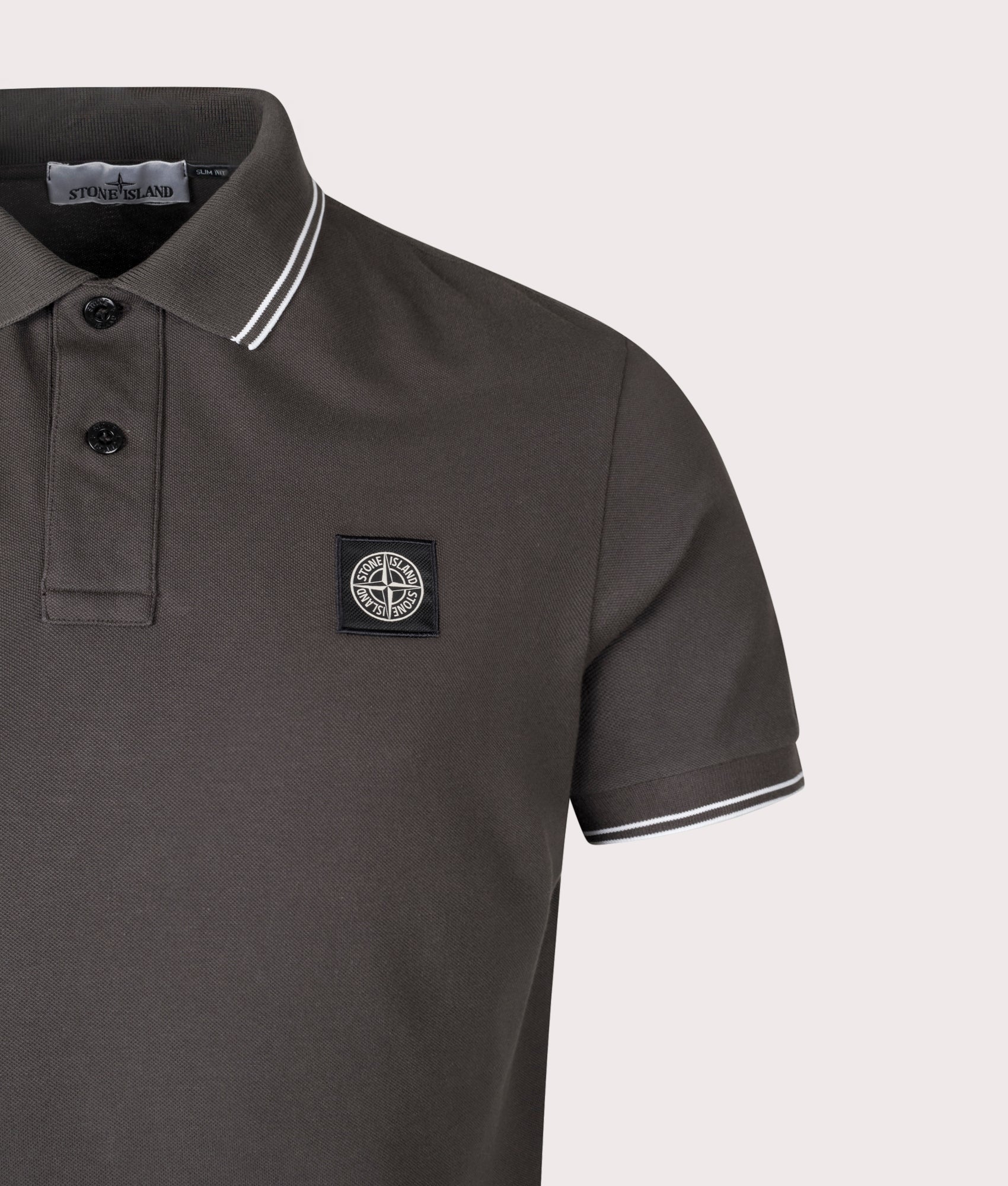 Stone Island Slim Fit Striped Collar Polo Shirt in Lead Grey at EQVVS Menswear. Detail shot.