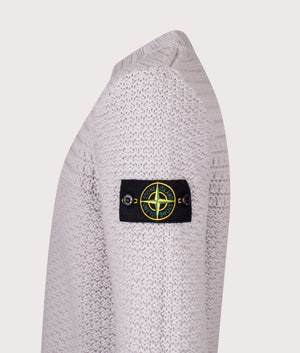 Mock Neck Wool Jumper in Pearl Grey. 100% Wool | Stone Island | Shot at EQVVS | Side detail shot 