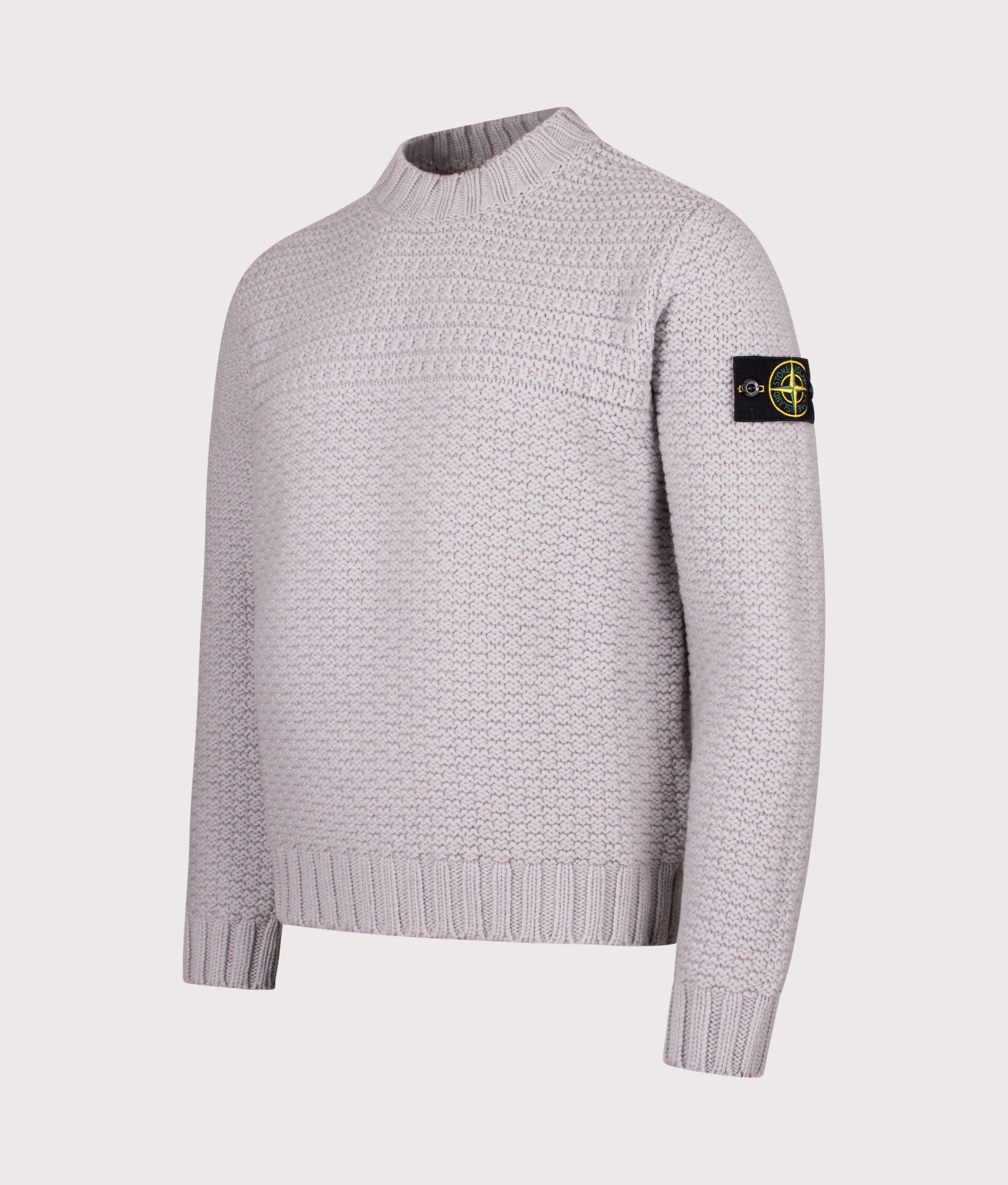 Mock Neck Wool Jumper in Pearl Grey. 100% Wool | Stone Island | Shot at EQVVS | Front angle shot