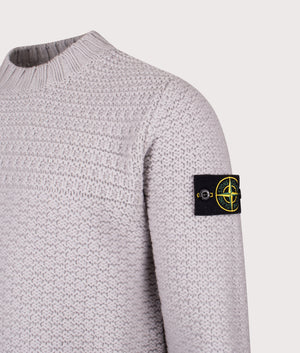 Mock Neck Wool Jumper in Pearl Grey. 100% Wool | Stone Island | Shot at EQVVS | Side angle detail shot 