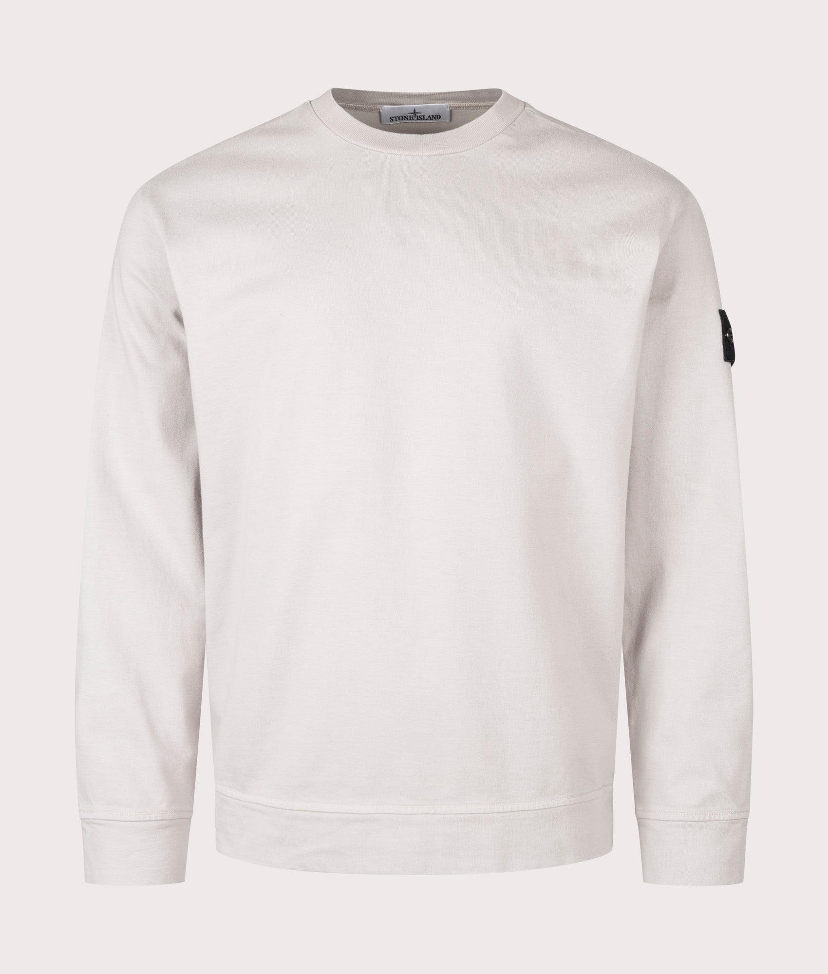 Stone Island Heavy Cotton Sweatshirt in Pearl Grey at EQVVS Menswear. Front shot.