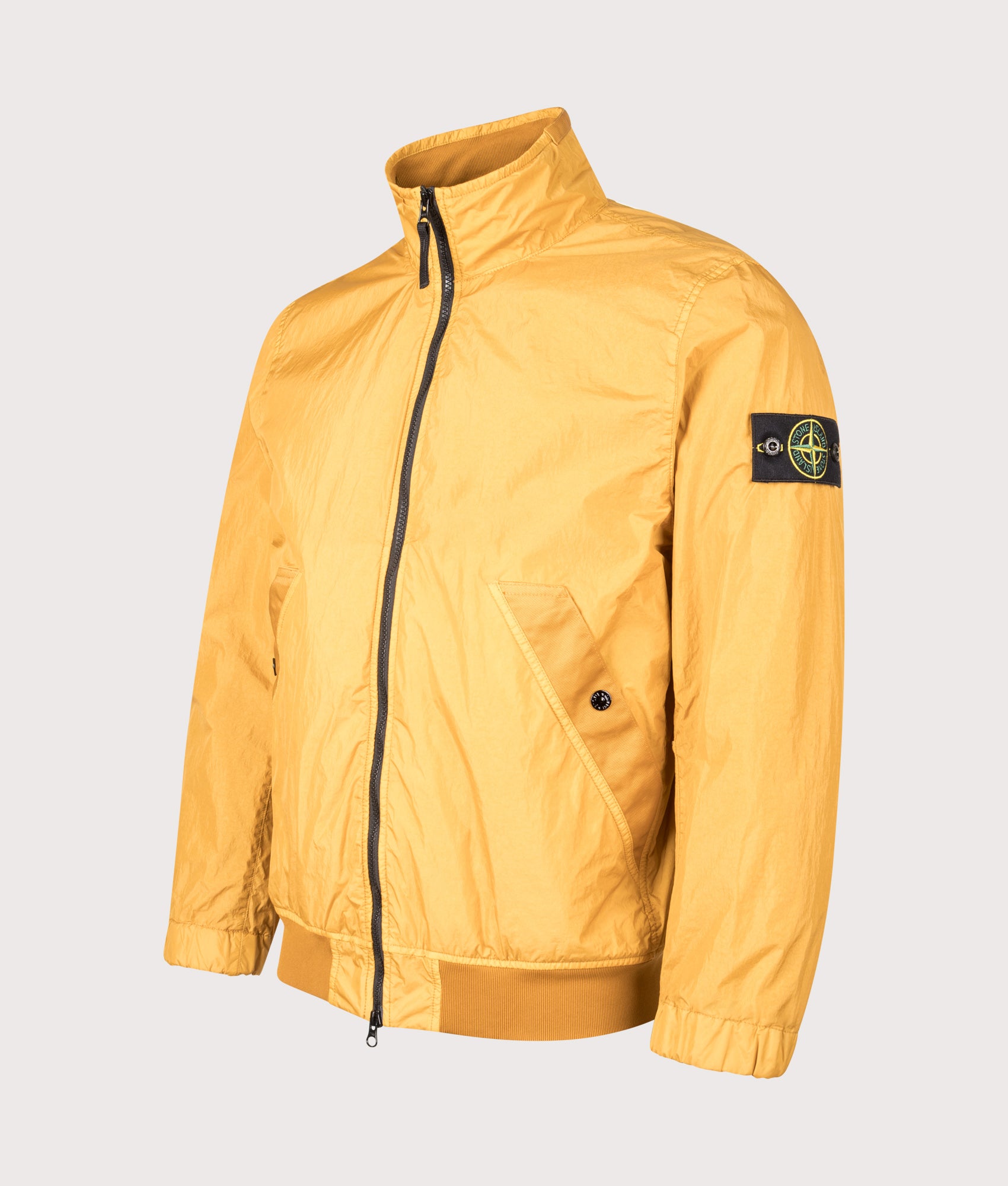 Crinkle Reps NY Stand Collar Bomber Jacket in Mustard | Stone Island | EQVVS | Front angle shot 