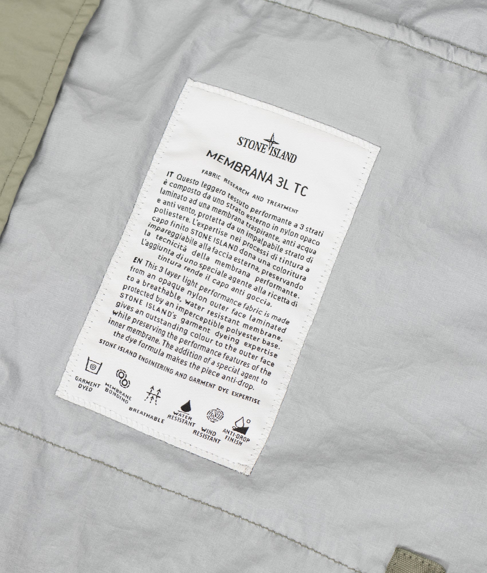 Stone Island Membrana 3L TC Jacket in Sage at EQVVS Menswear. Label shot.