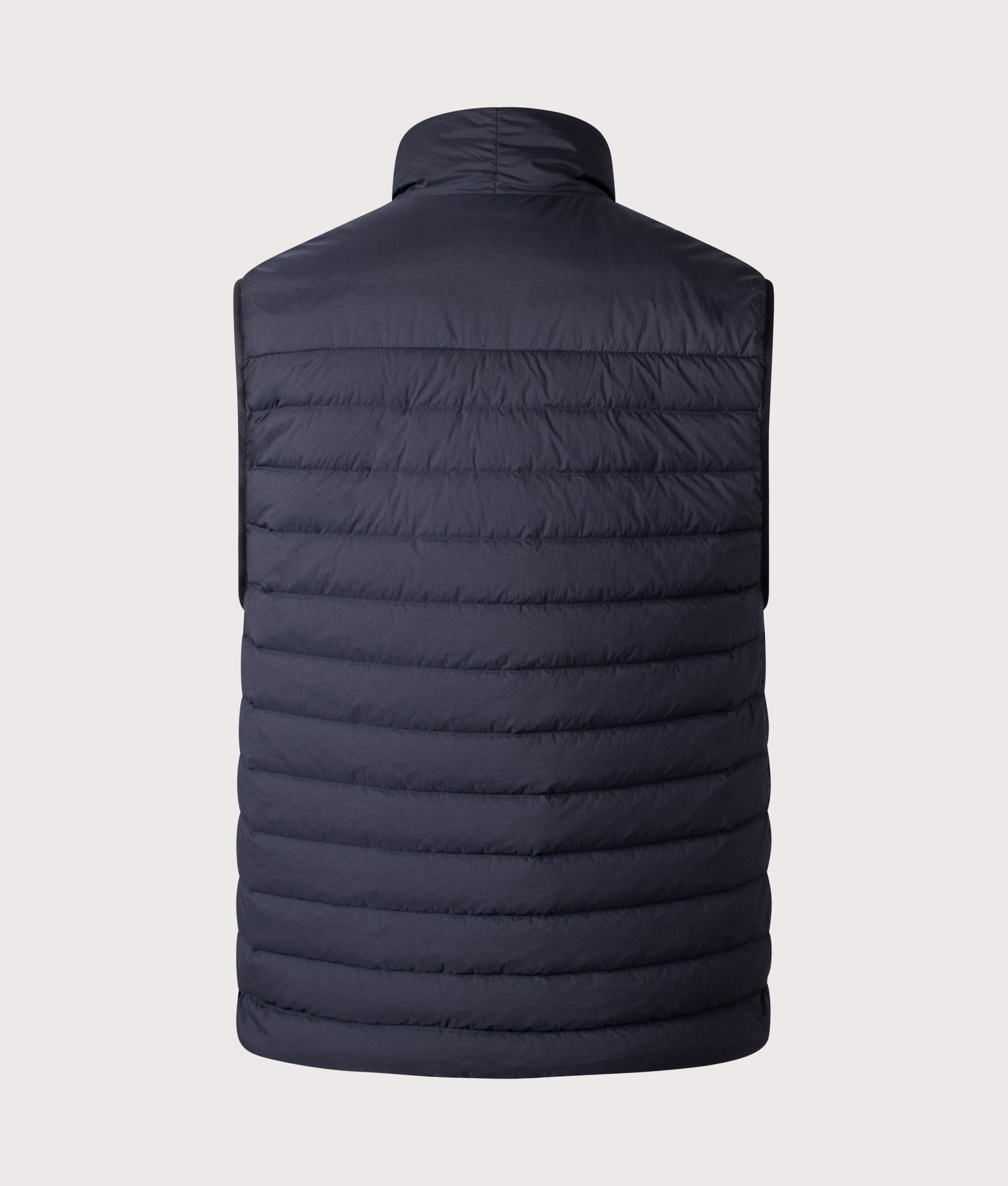 Stone Island Seamless Tunnel Nylon Down-TC Vest in Navy Blue at EQVVS Menswear. Back shot.