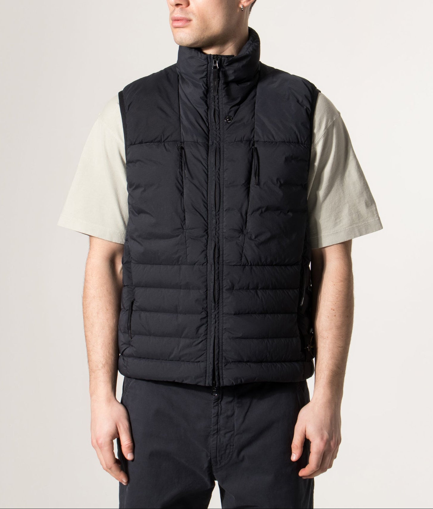 Stone Island Seamless Tunnel Nylon Down-TC Vest in Navy Blue at EQVVS Menswear. Model front shot.