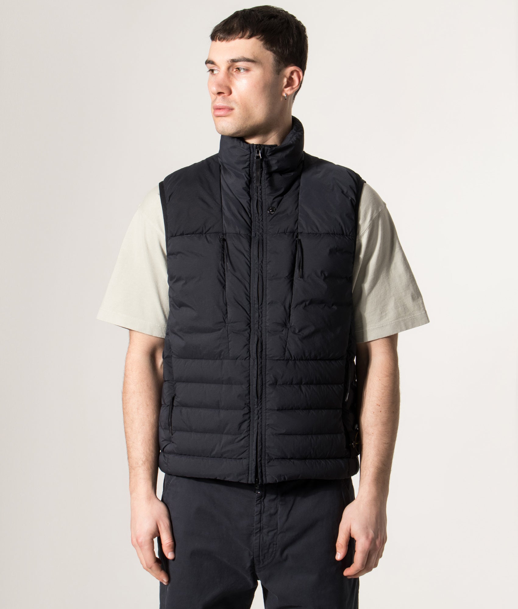 Stone Island Seamless Tunnel Nylon Down-TC Vest in Navy Blue at EQVVS Menswear. Model front shot.