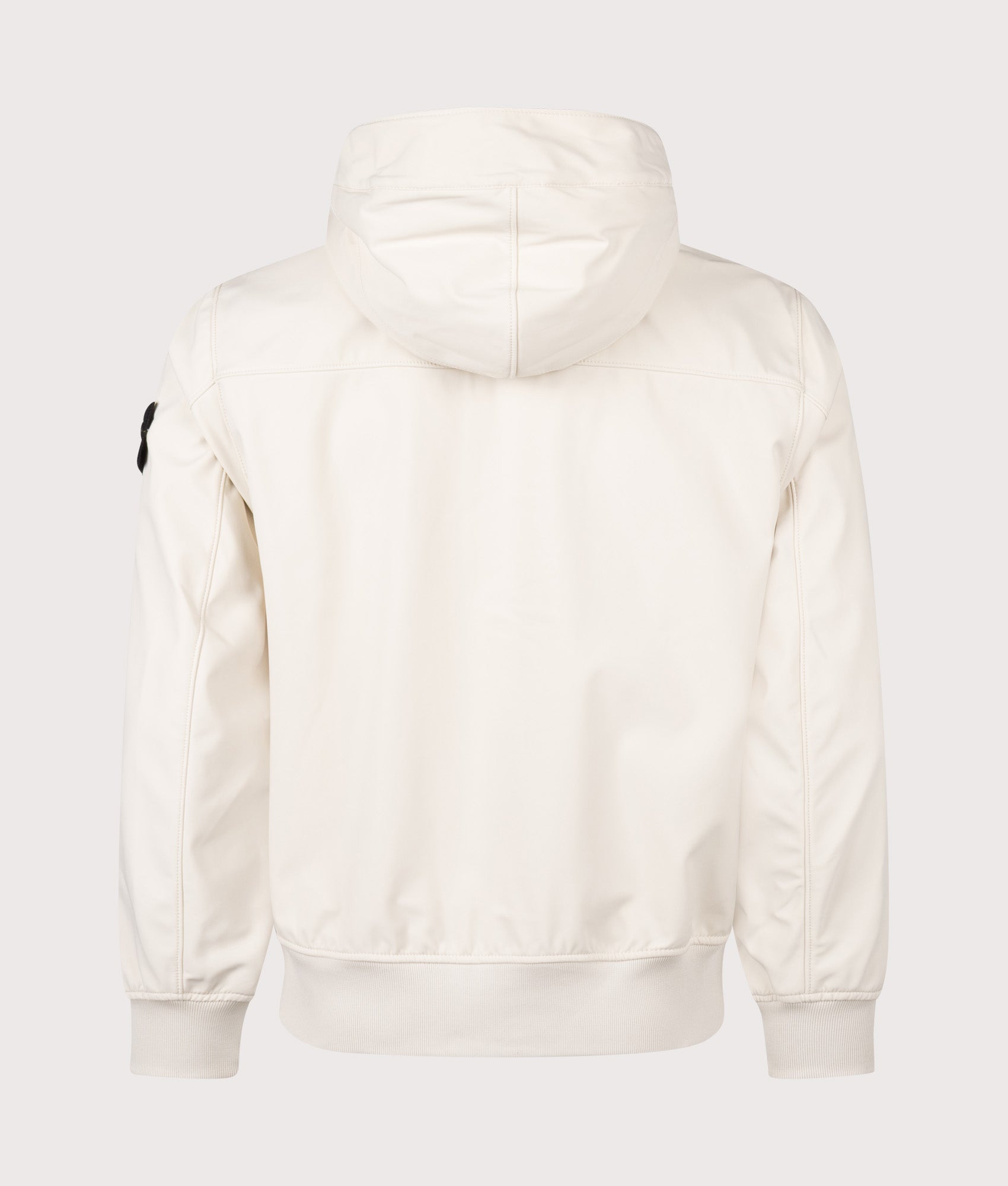 Stone Island Light Soft Shell-R E.DYE® Technology Hooded Jacket in Ivory at EQVVS Menswear. Back shot.