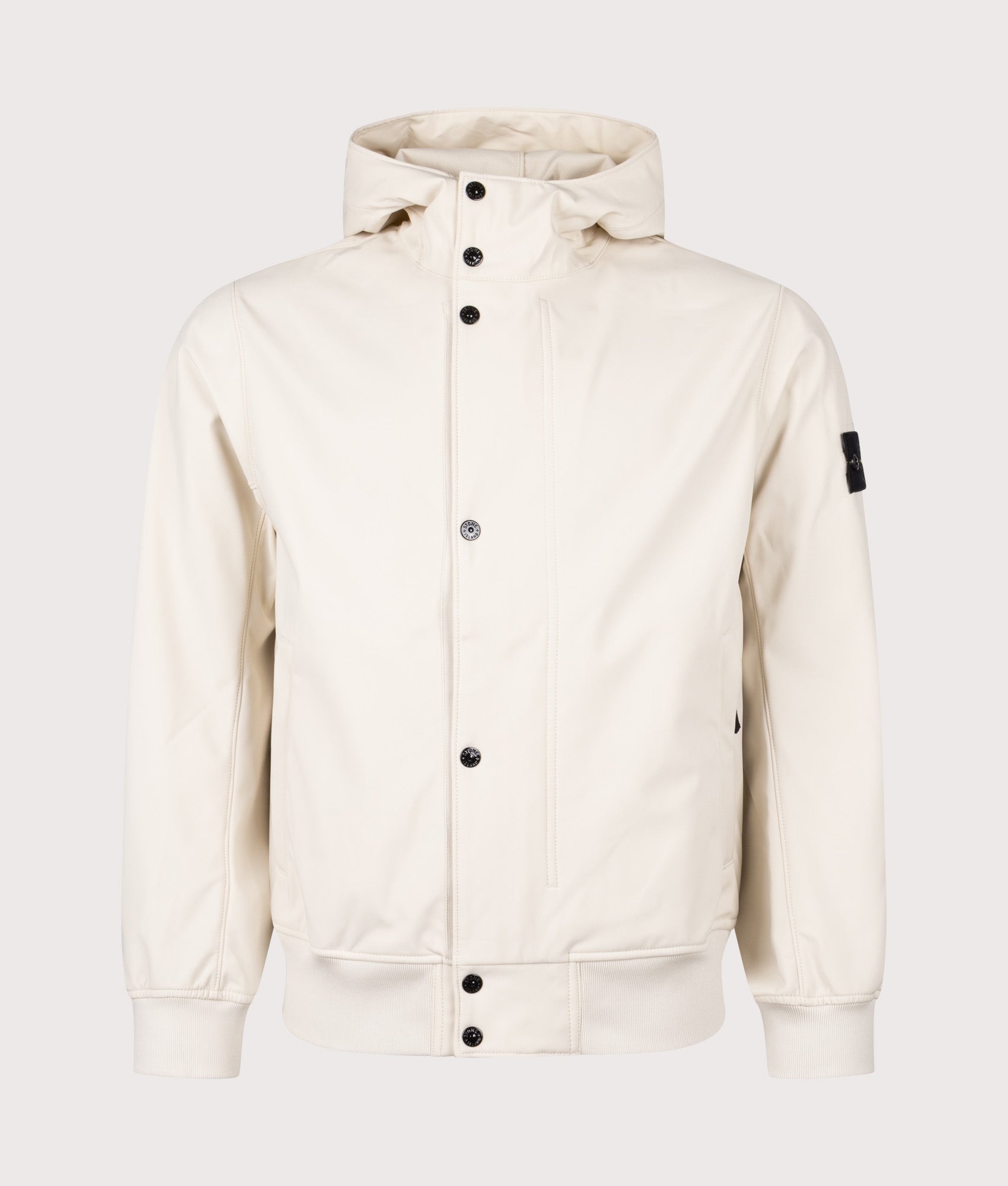 Stone Island Light Soft Shell-R E.DYE® Technology Hooded Jacket in Ivory at EQVVS Menswear. Front shot.