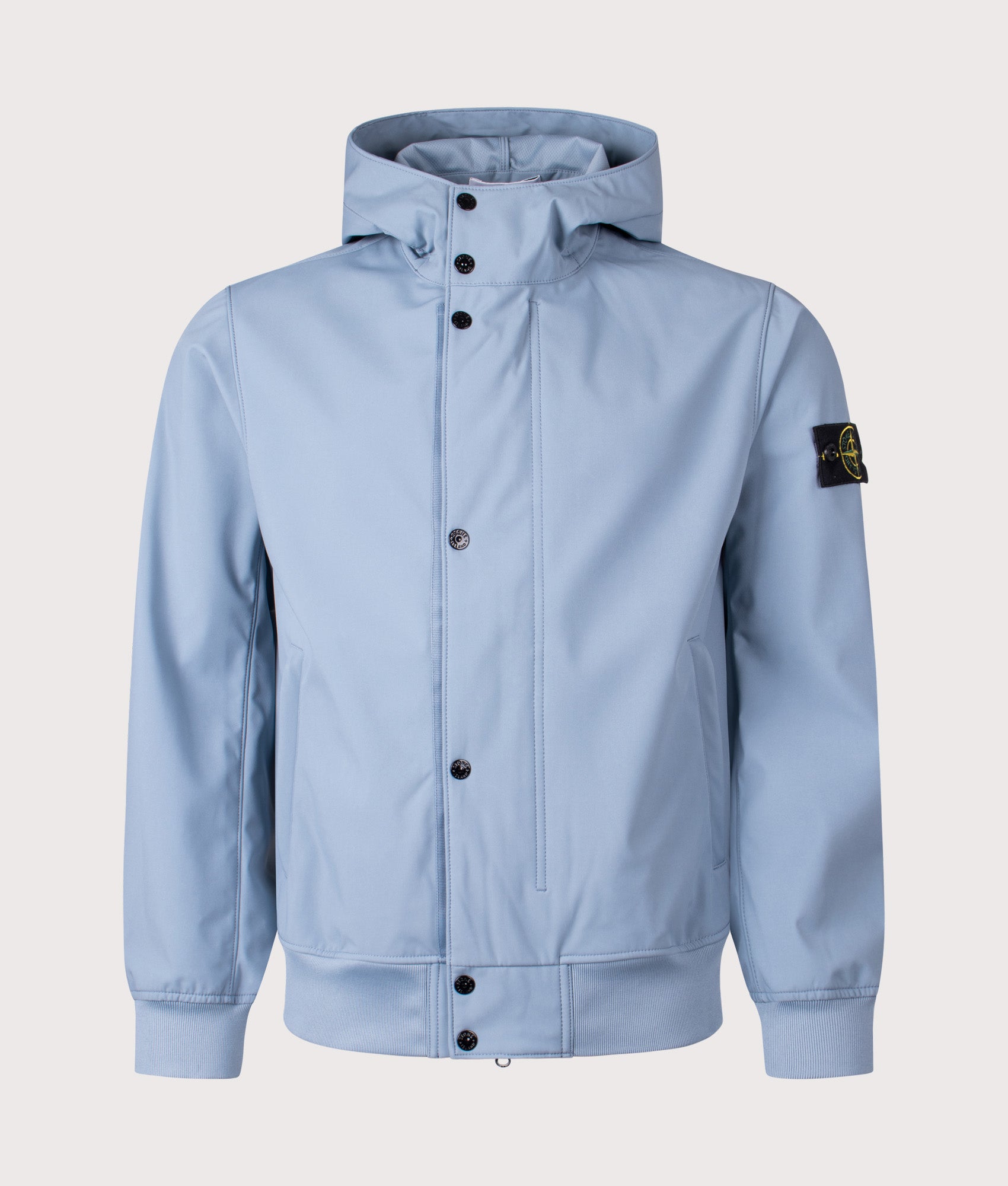 Stone Island release the Light Soft Shell-R E.DYE® Technology Hooded Jacket in Avio Blue at EQVVS Menswear. Front shot.