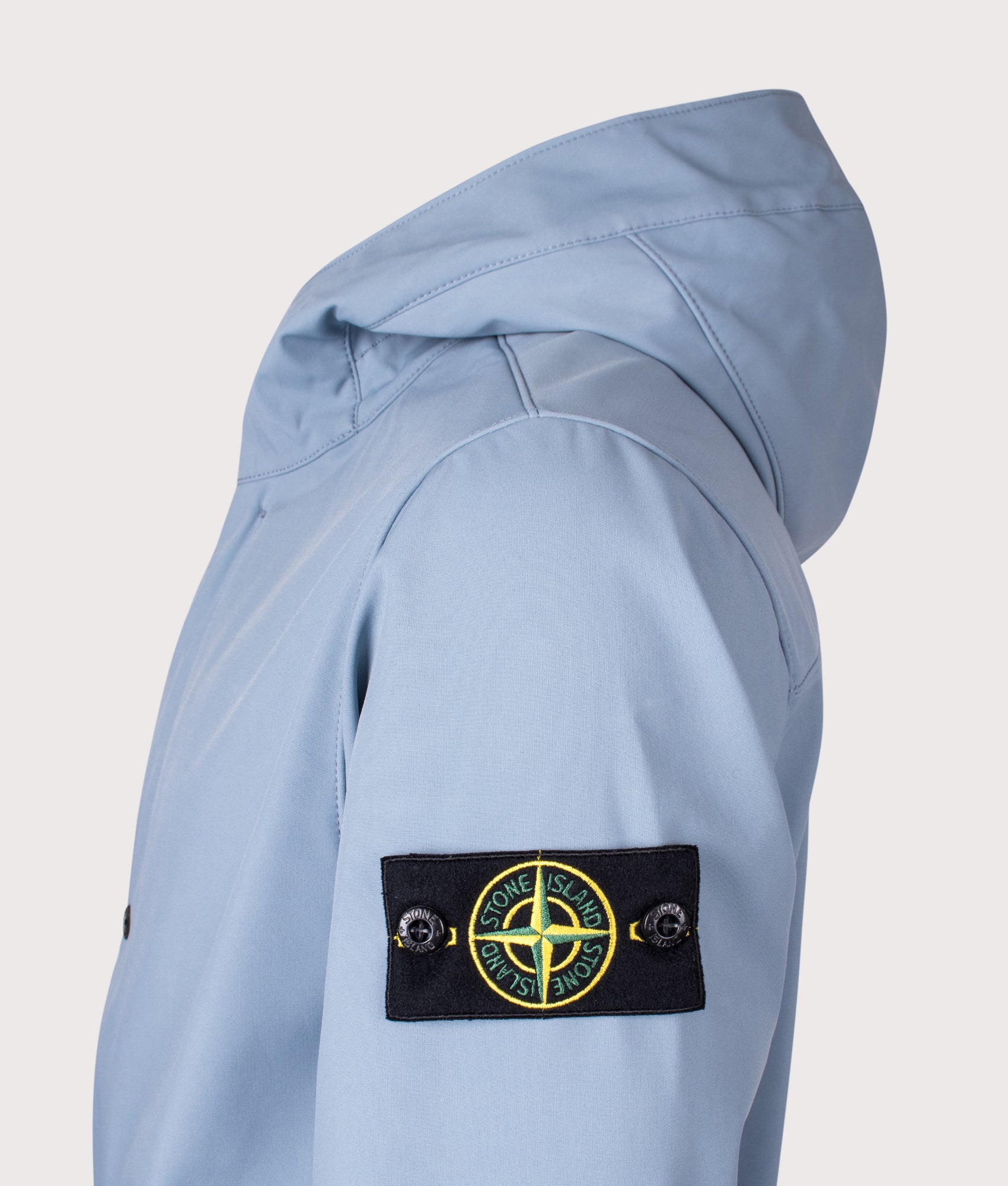 Stone Island release the Light Soft Shell-R E.DYE® Technology Hooded Jacket in Avio Blue at EQVVS Menswear. Detail shot.