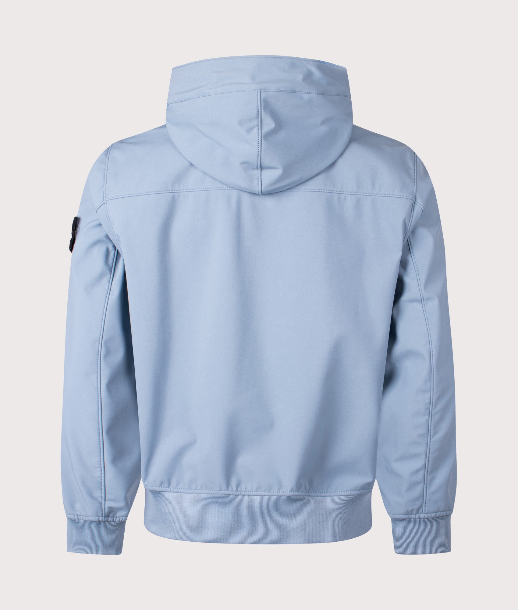Stone Island release the Light Soft Shell-R E.DYE® Technology Hooded Jacket in Avio Blue at EQVVS Menswear. Back shot.