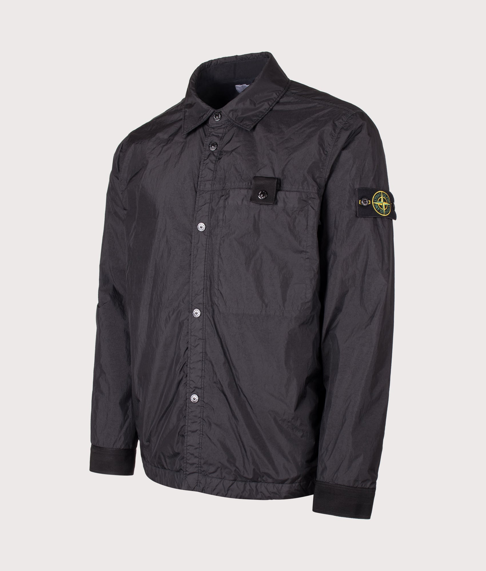 Stone Island Crinkle Reps NY Jacket in Black at EQVVS Menswear. Angled front shot.