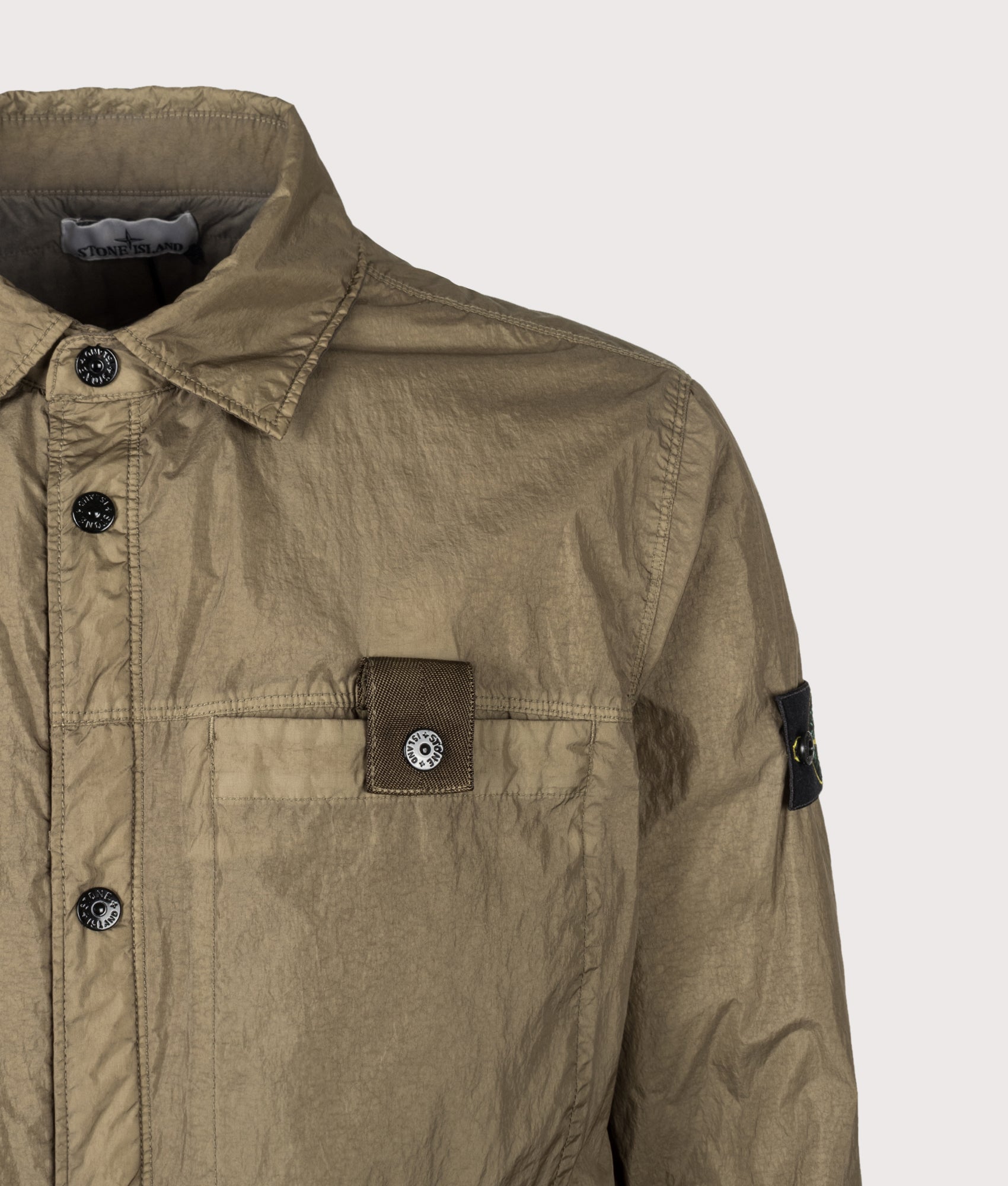 Stone Island Crinkle Reps NY Jacket in Military Green at EQVVS Menswear. Second detail shot.