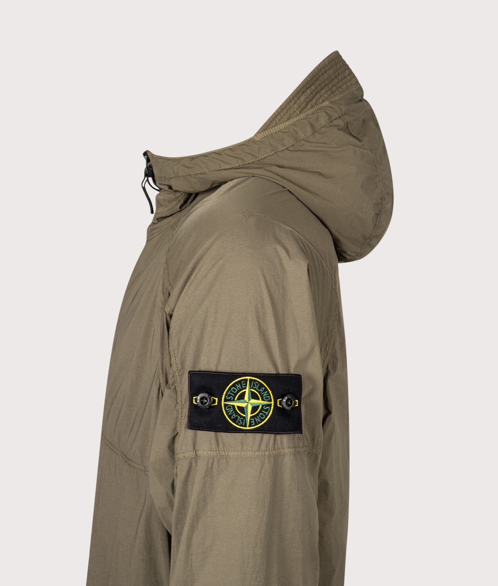 Stone Island Ultralight Nylon Stretch-TC Jacket in Military Green at EQVVS Menswear. Detail shot.