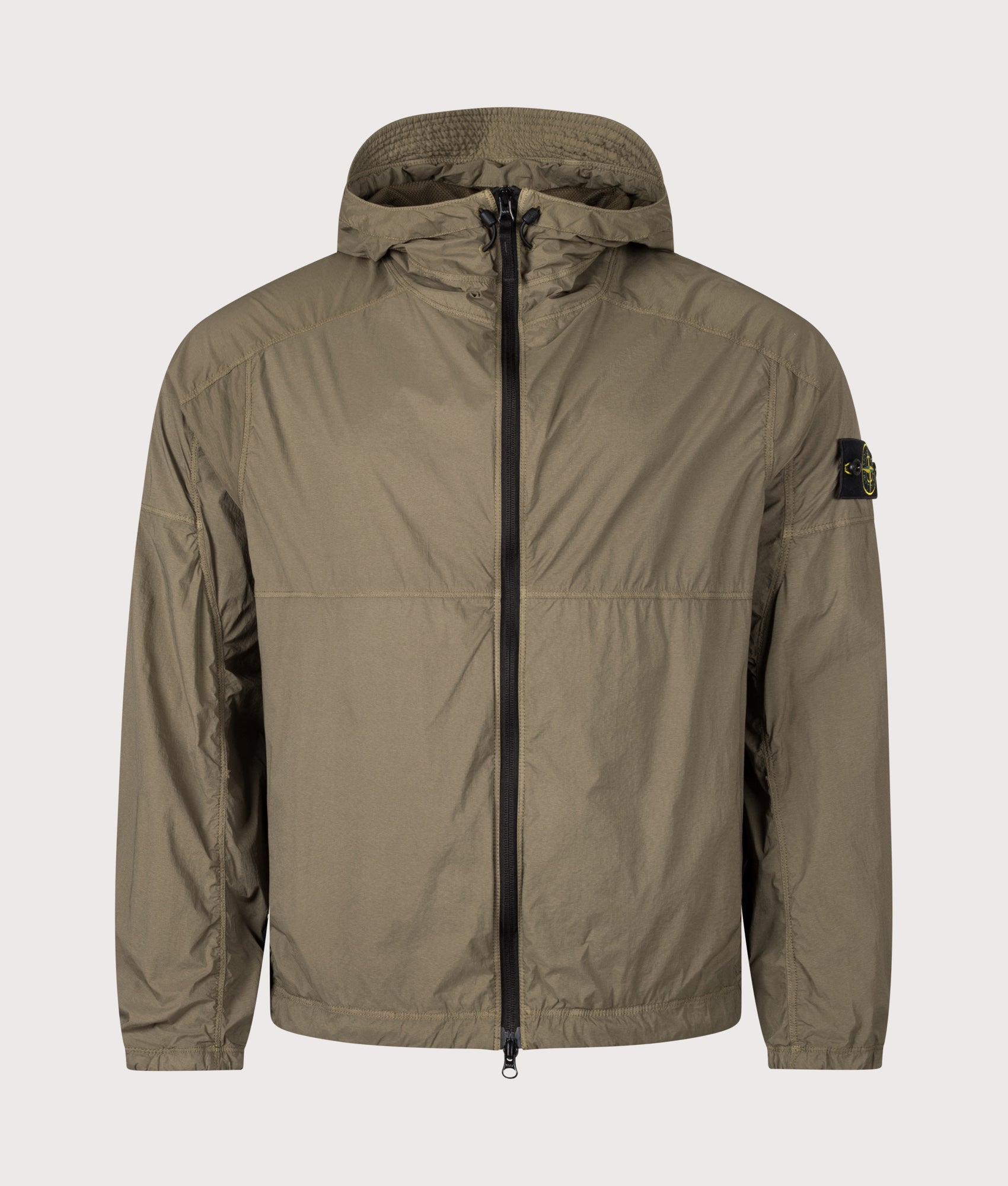 Stone Island Ultralight Nylon Stretch-TC Jacket in Military Green at EQVVS Menswear. Front shot.