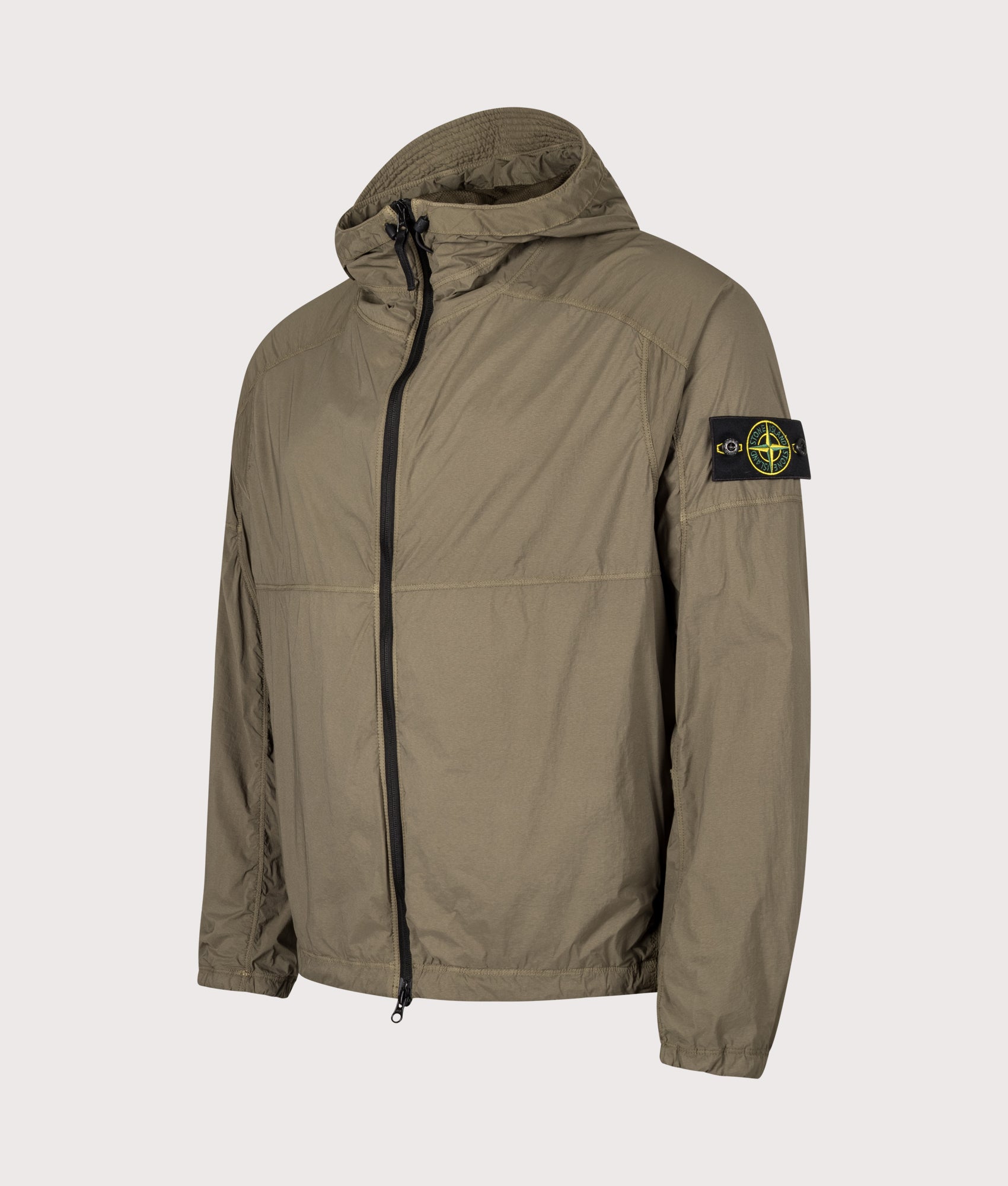 Stone Island Ultralight Nylon Stretch-TC Jacket in Military Green at EQVVS Menswear. Angled front shot.