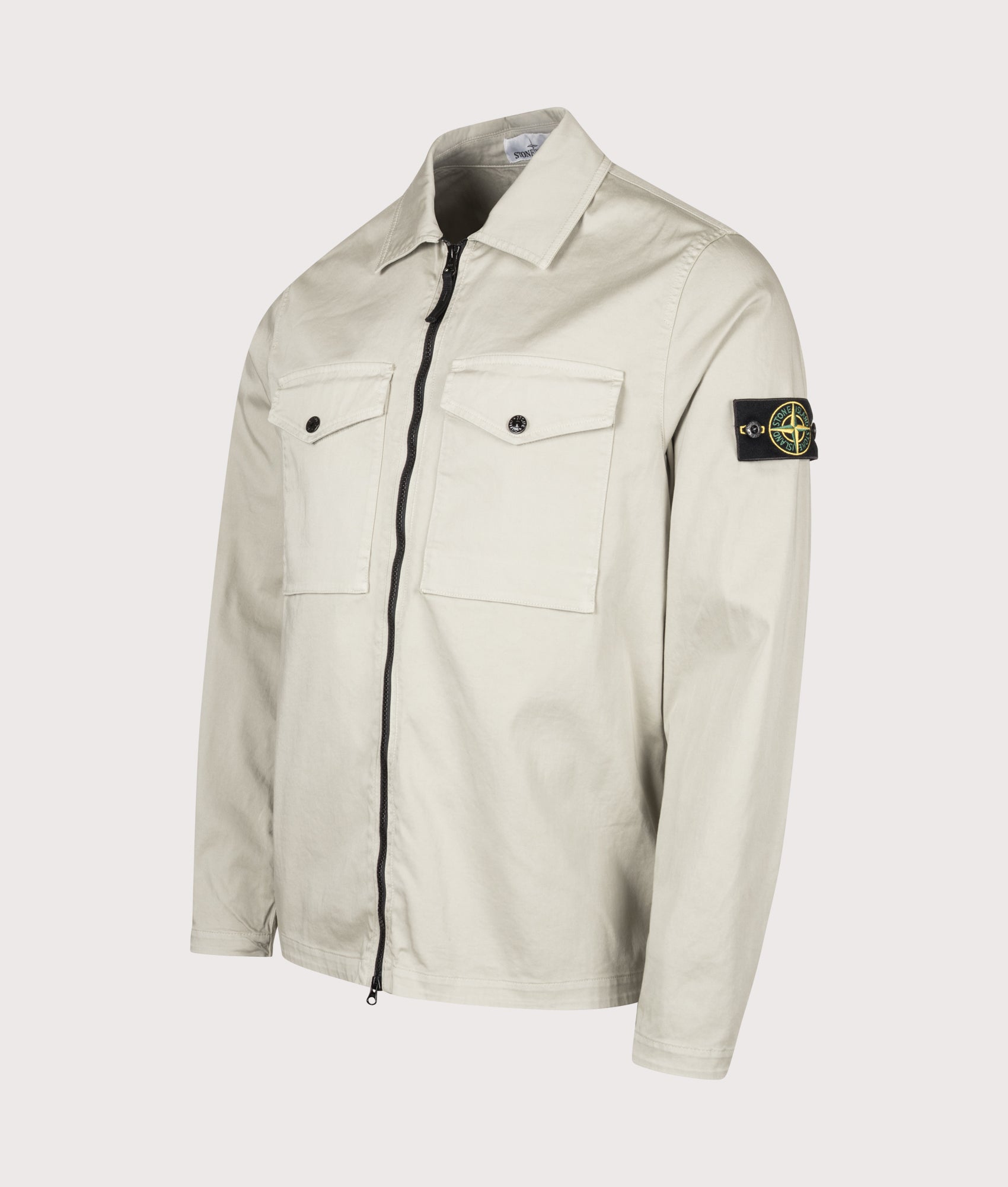 Stone Island Stretch Organic Cotton Satin Overshirt in Sand at EQVVS Menswear. Angled front shot.
