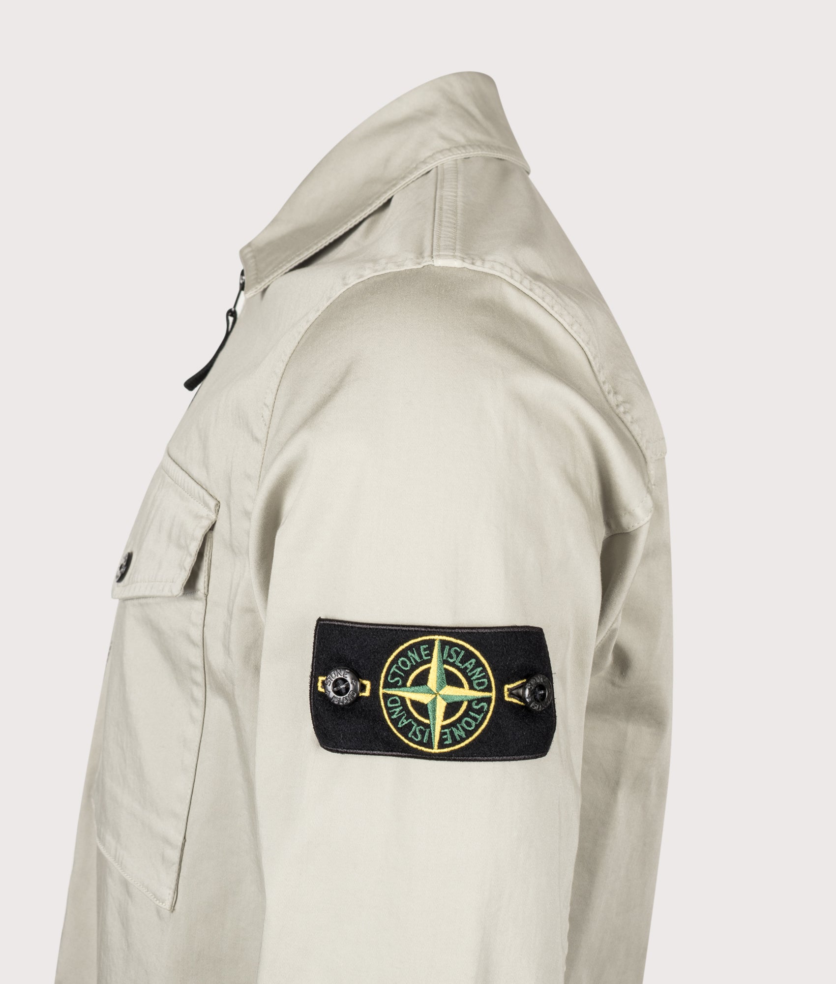 Stone Island Stretch Organic Cotton Satin Overshirt in Sand at EQVVS Menswear. Detail shot.