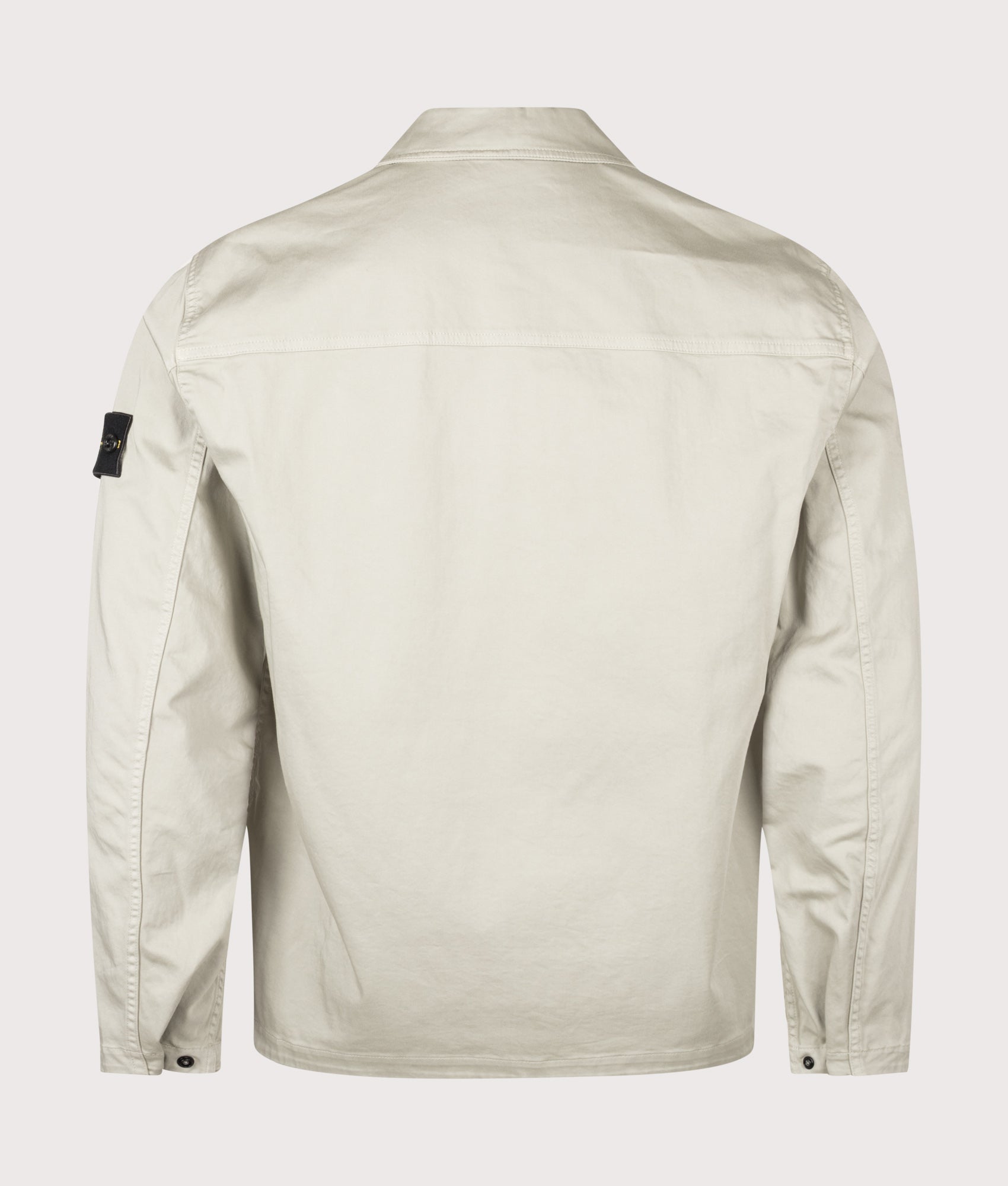 Stone Island Stretch Organic Cotton Satin Overshirt in Sand at EQVVS Menswear. Back shot.
