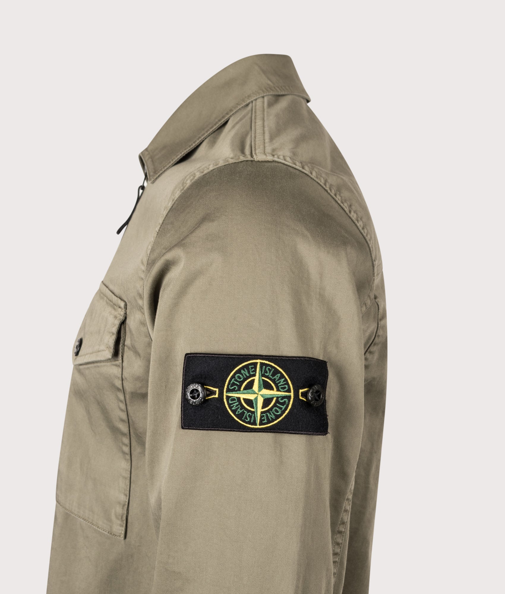 Stone Island Stretch Organic Cotton Satin Overshirt in Military Green at EQVVS Menswear. Detail shot.