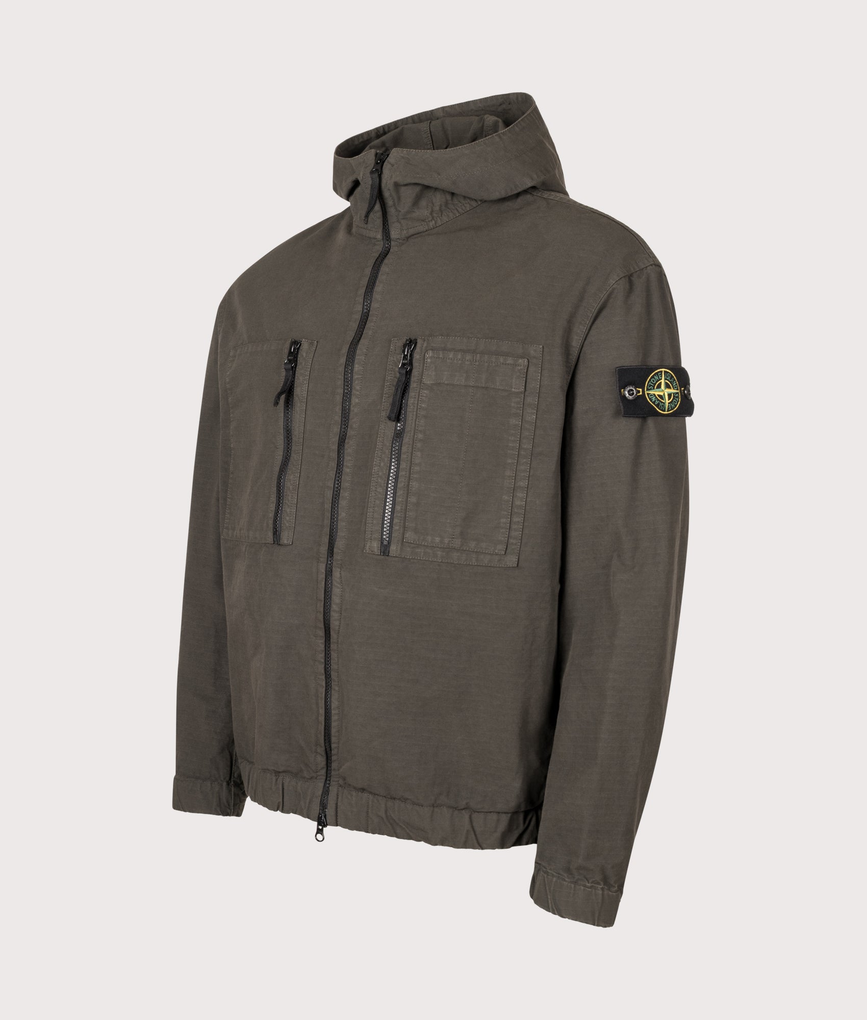 Stone Island Comfort Fit Organic Cotton Ripstop Hooded Overshirt in Coal Grey at EQVVS Menswear. Angled front shot.