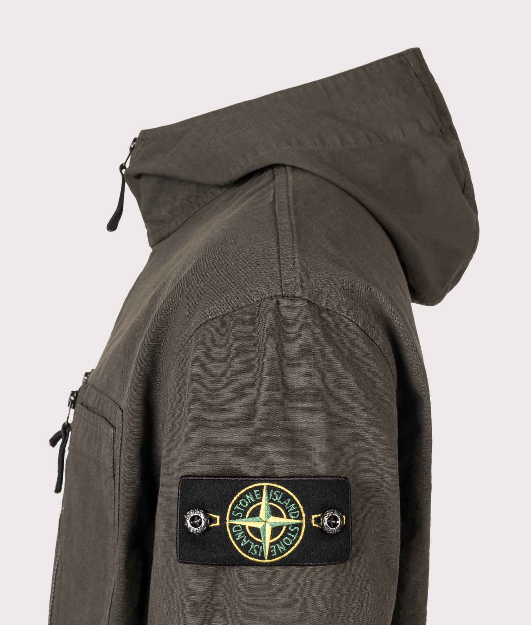 Stone Island Comfort Fit Organic Cotton Ripstop Hooded Overshirt in Coal Grey at EQVVS Menswear. Detail shot.