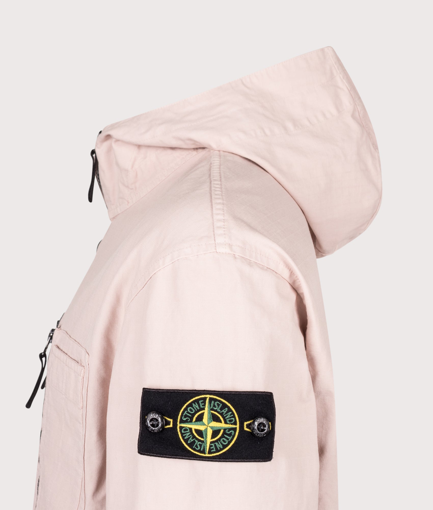 Stone Island Comfort Fit Organic Cotton Ripstop Hooded Overshirt in Antique Rose at EQVVS Menswear. Detail shot.
