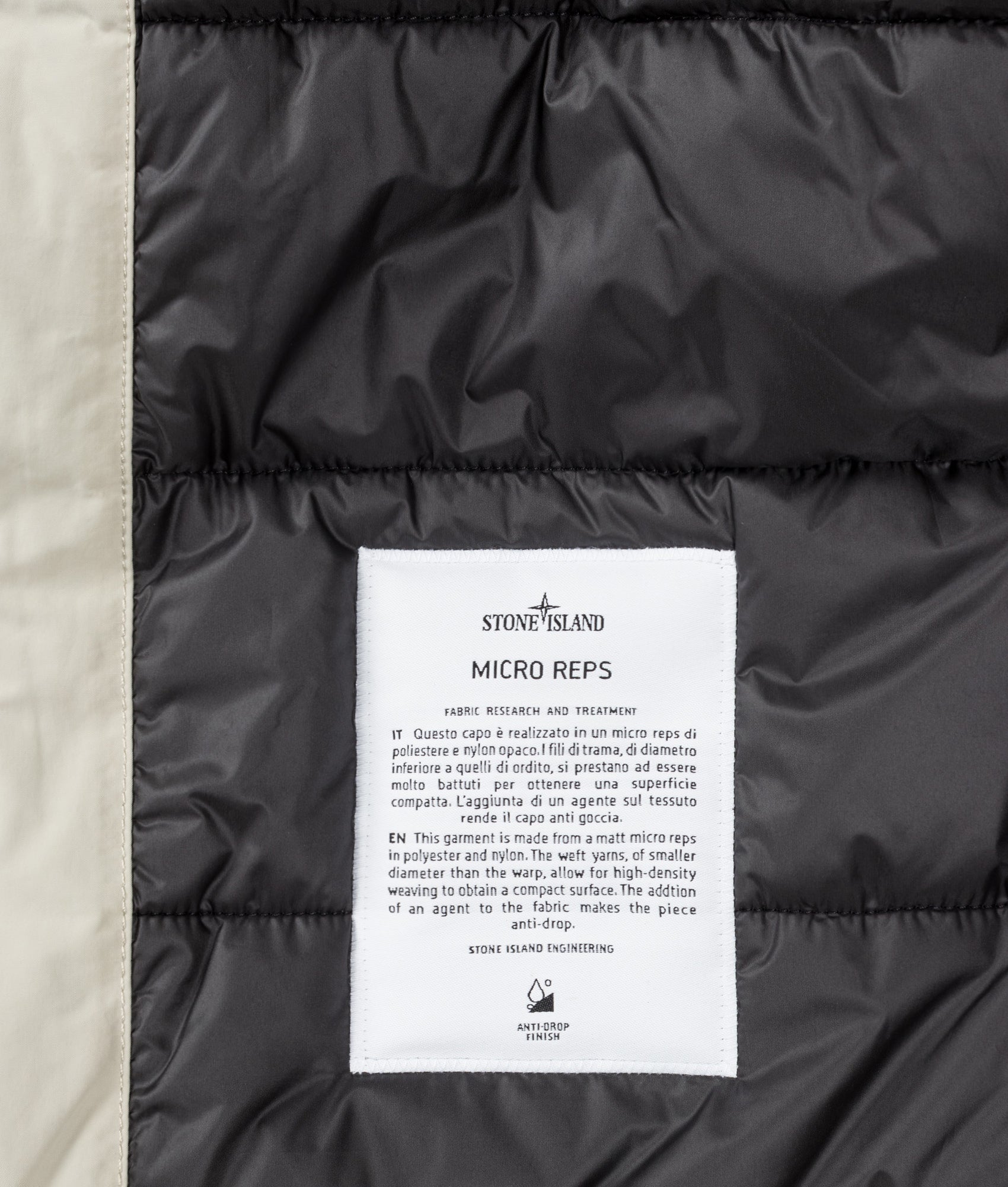 Stone Island Micro Twill Jacket in Sand at EQVVS Menswear. Label shot.