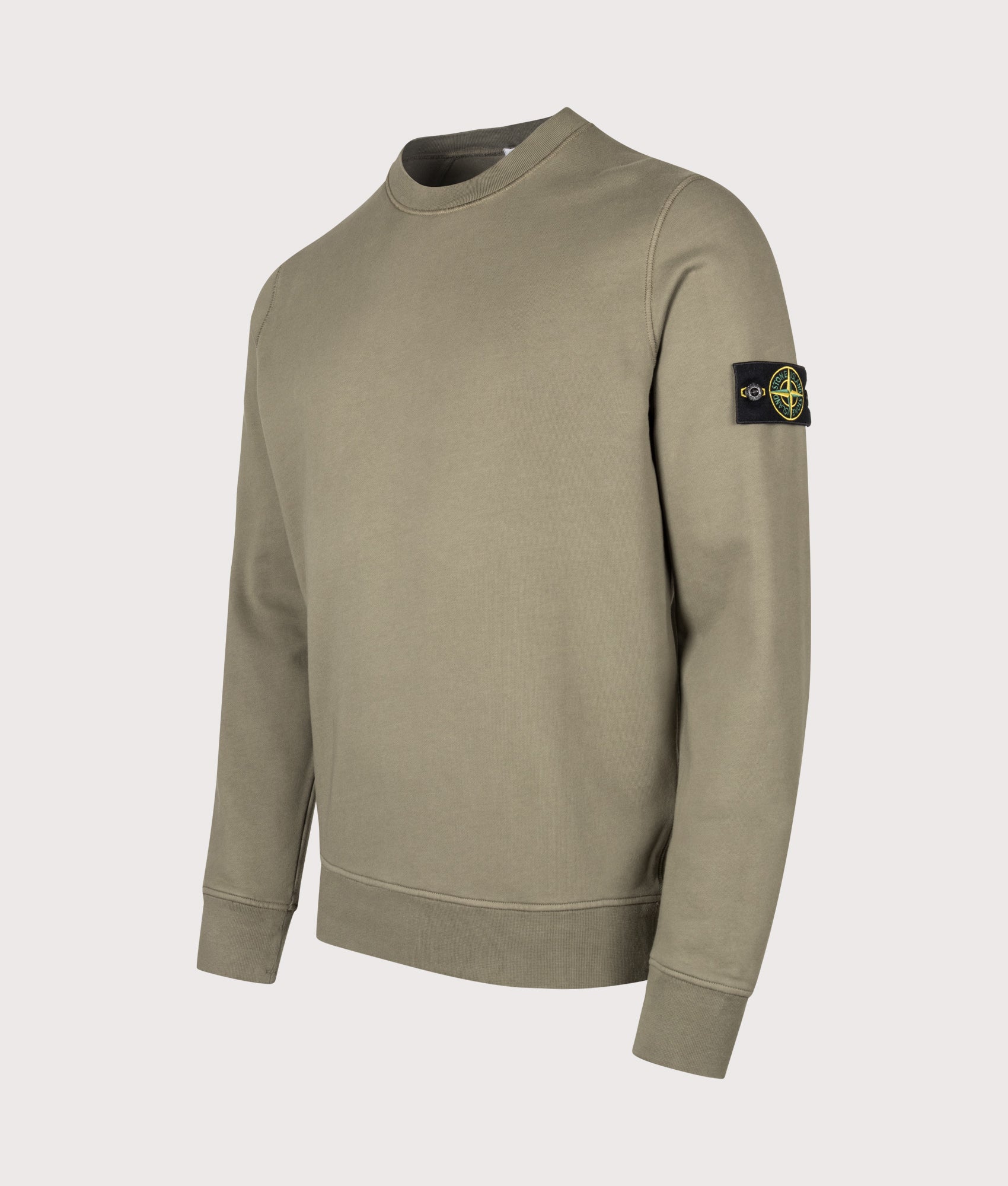 Stone Island Organic Cotton Fleece Sweatshirt in Military Green at EQVVS Menswear. Angled front shot.