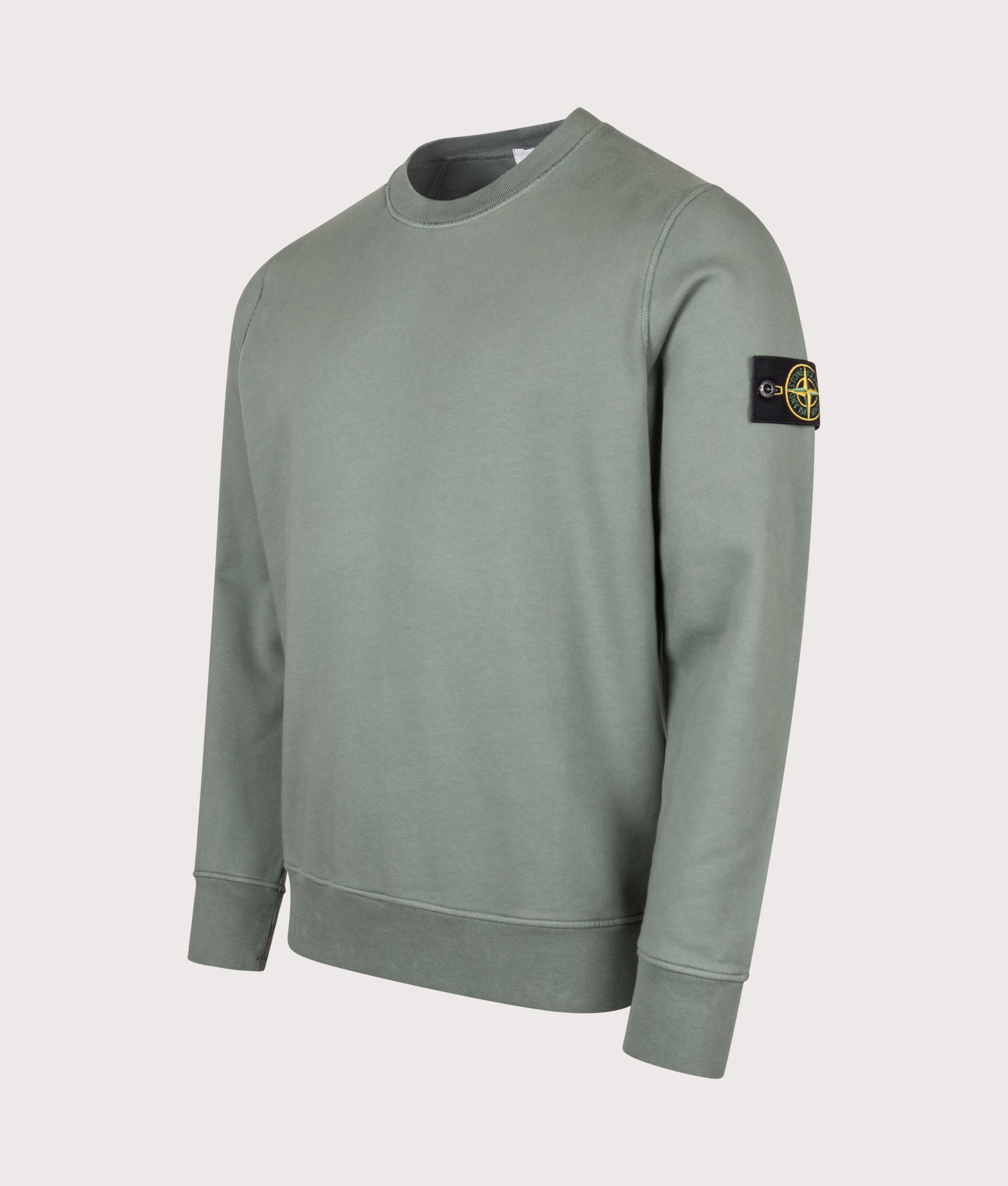 Stone Island Organic Cotton Fleece Sweatshirt in Ocean Green at EQVVS Menswear. Angled front shot.