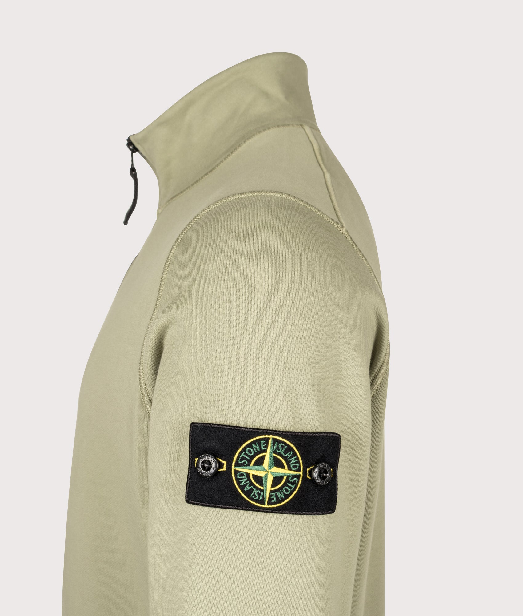 Stone Island Organic Cotton Fleece Quarter Zip Sweatshirt in Laurel Green at EQVVS Menswear. Detail shot.