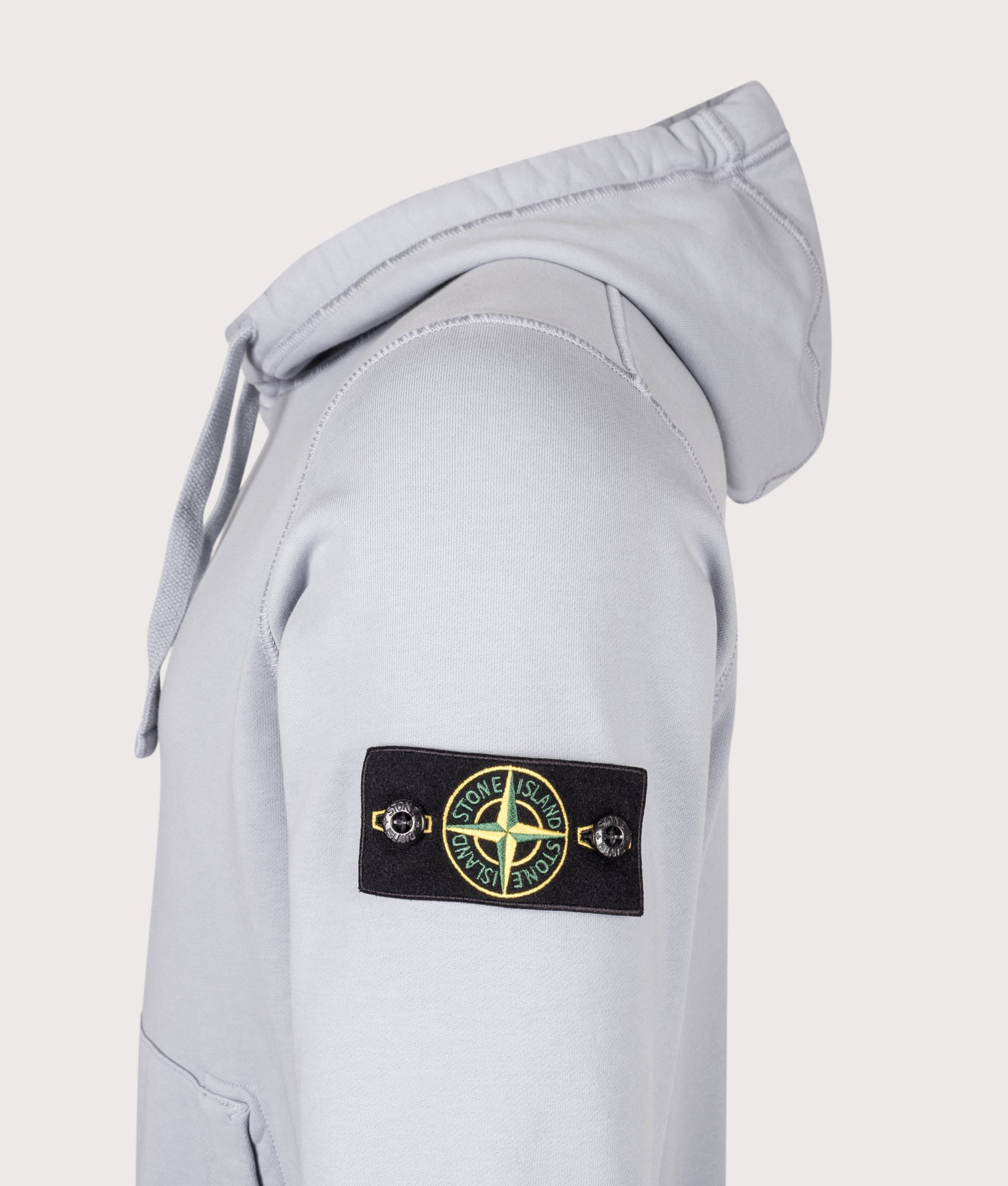 Stone Island Organic Cotton Fleece Hoodie in Ash Grey at EQVVS Menswear. Detail shot.