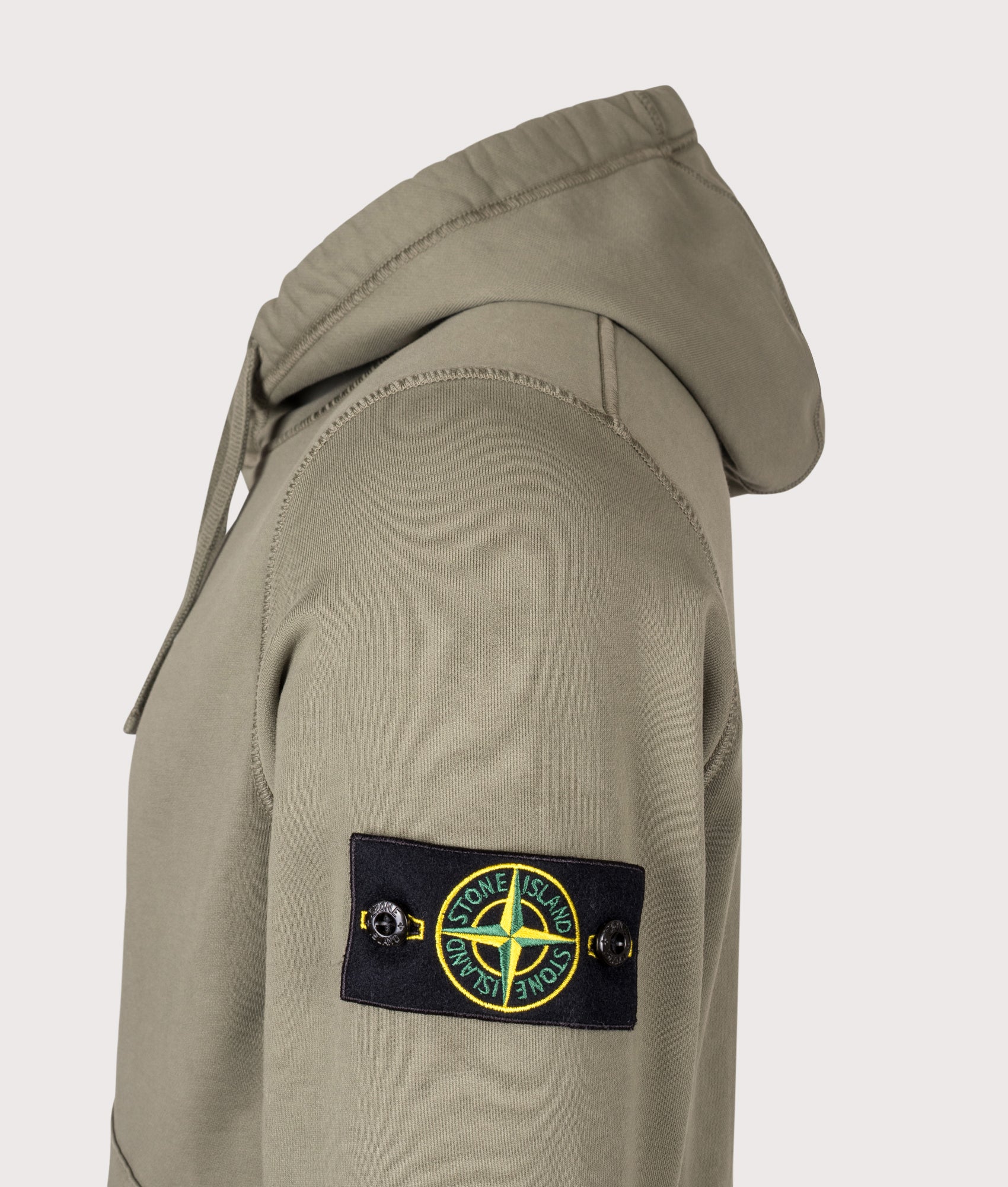 Stone Island Organic Cotton Fleece Hoodie in Military Green at EQVVS Menswear. Detail shot.
