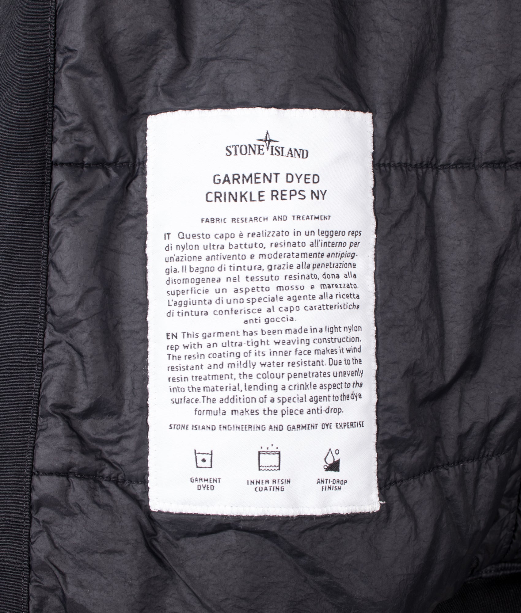 Stone Island Crinkle Reps NY Jacket in Black at EQVVS Menswear. Label shot.