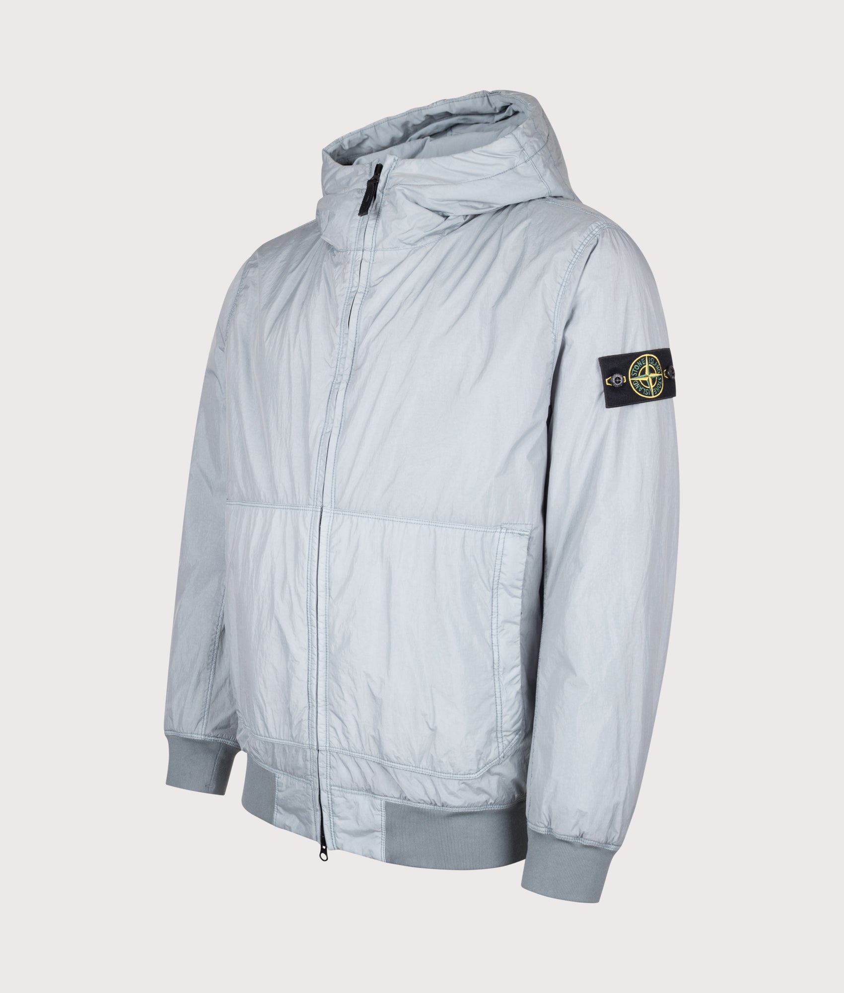Stone Island Crinkle Reps NY Jacket in Ash Grey at EQVVS Menswear. Angled front shot.