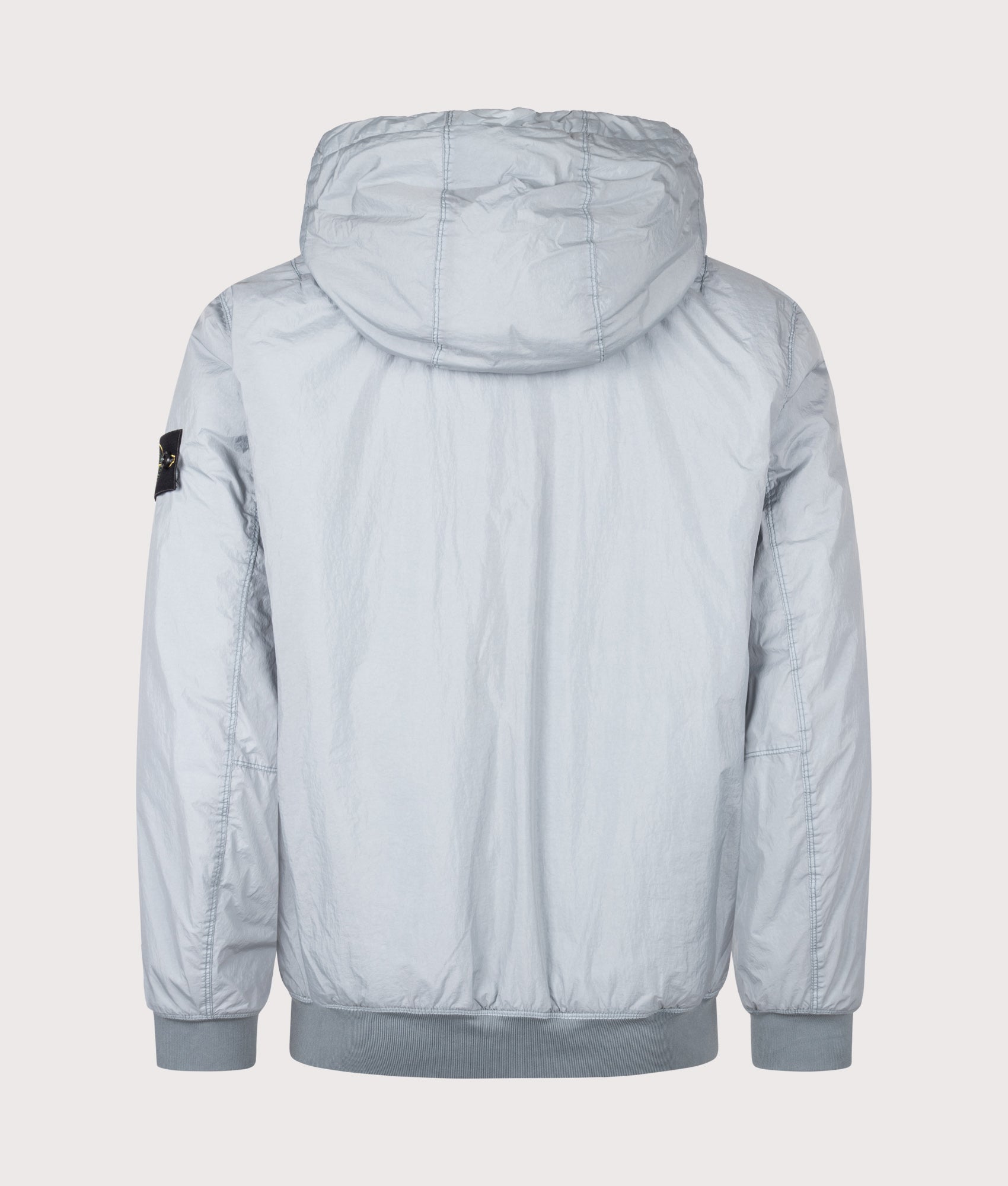 Stone Island Crinkle Reps NY Jacket in Ash Grey at EQVVS Menswear. Back shot.