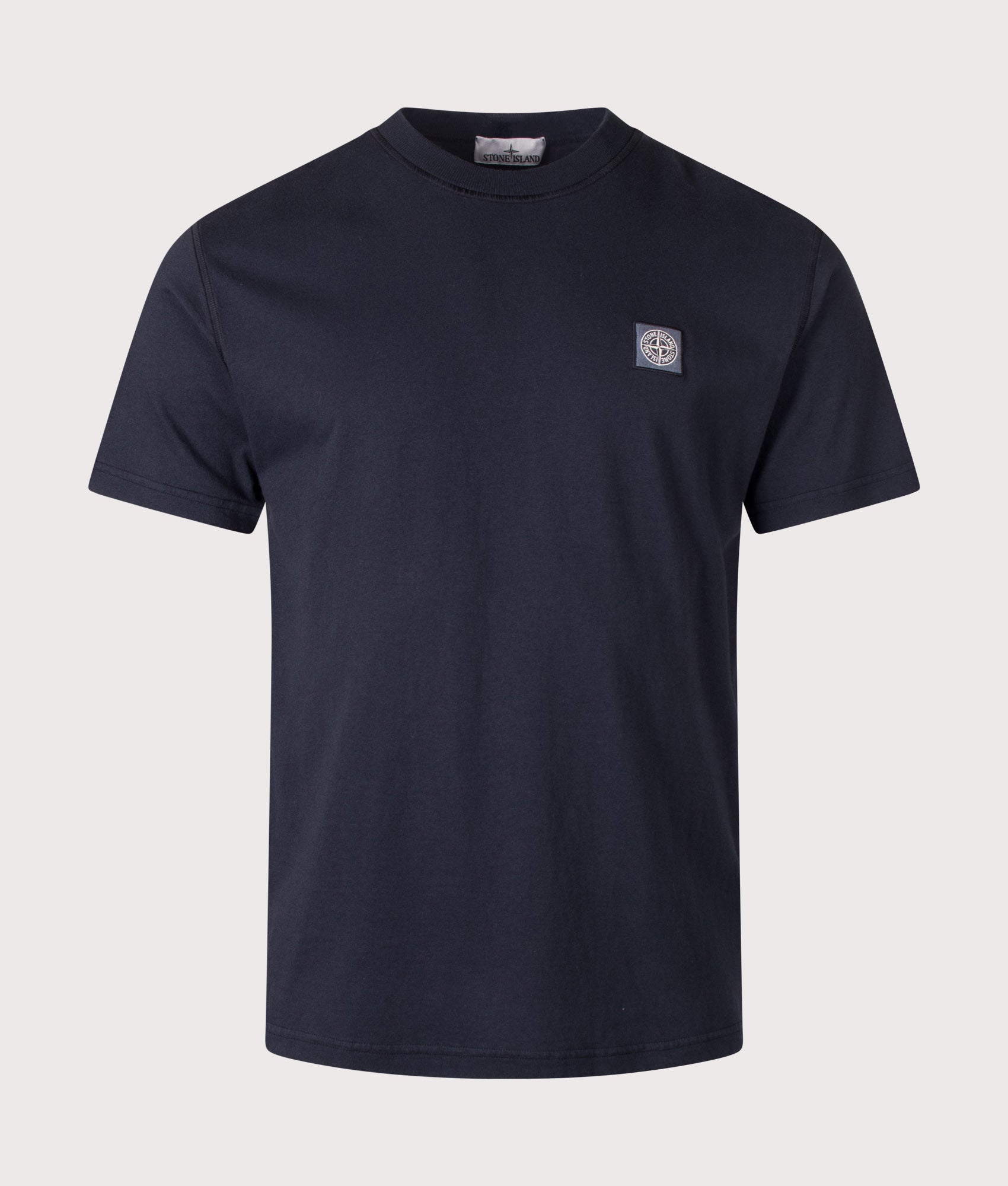 Stone Island Slim Fit Organic Cotton 'FISSATO' Effect T-Shirt in Navy Blue at EQVVS Menswear. Front shot.