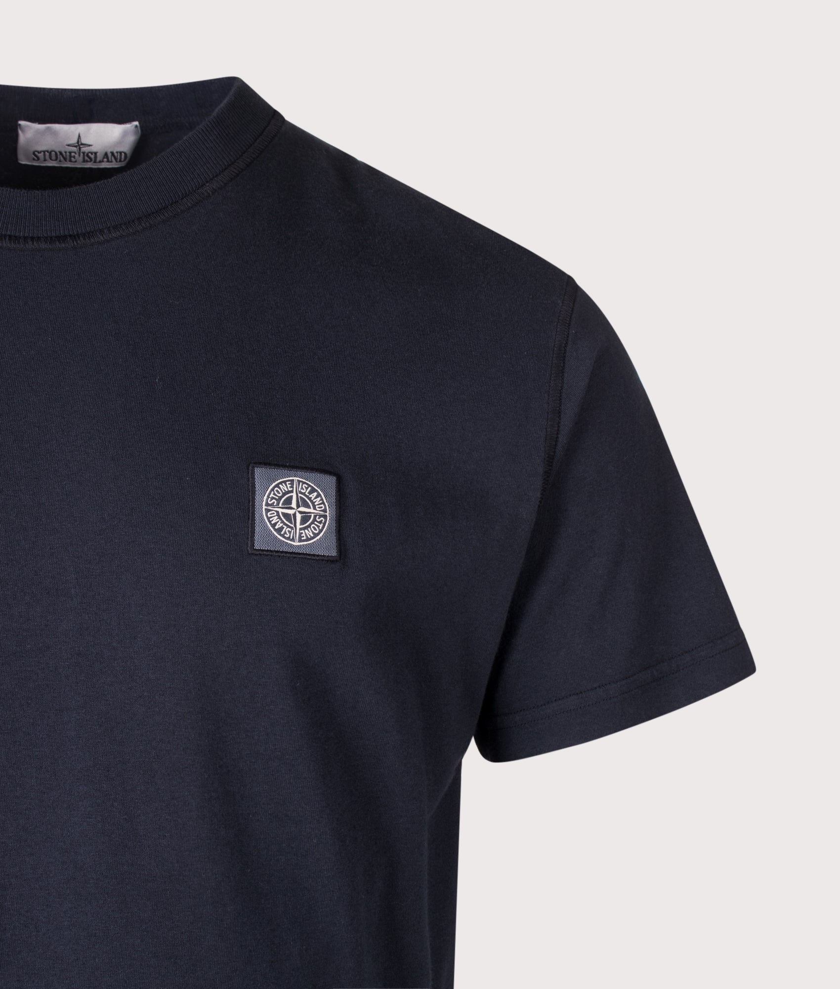 Stone Island Slim Fit Organic Cotton 'FISSATO' Effect T-Shirt in Navy Blue at EQVVS Menswear. Detail shot.