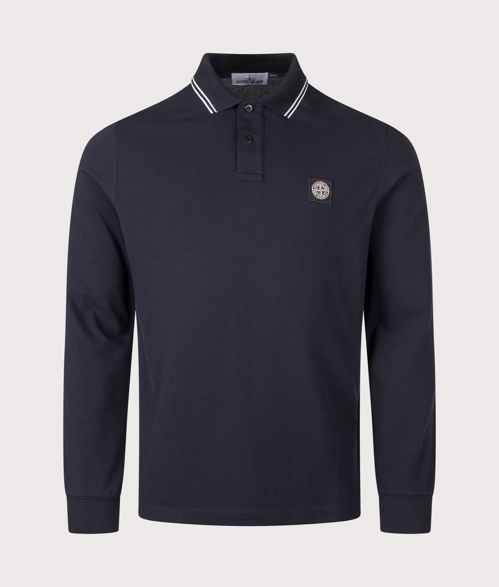 Stone Island Slim Fit Long Sleeve Polo Shirt in Navy Blue at EQVVS Menswear. Front shot.