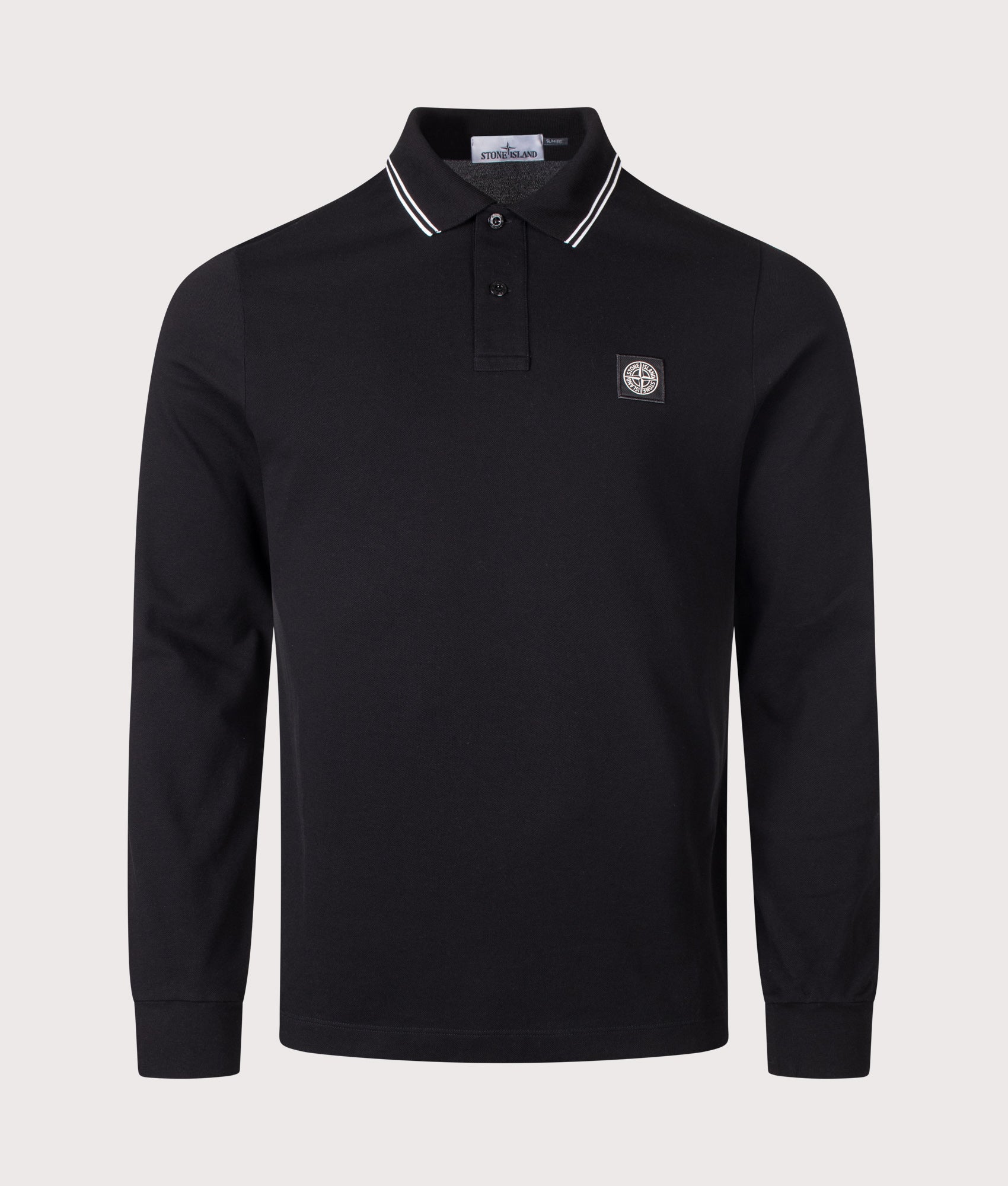 Stone Island Slim Fit Long Sleeve Polo Shirt in Black at EQVVS Menswear. Front shot.