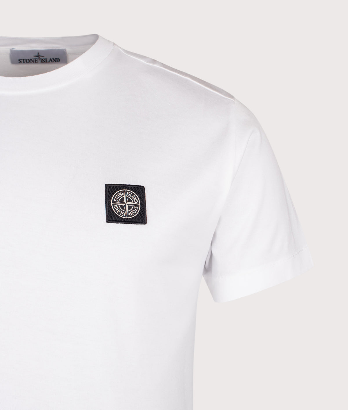 Stone Island Slim Fit 60/2 Cotton Jersey T-Shirt in White at EQVVS Menswear. Detail shot.
