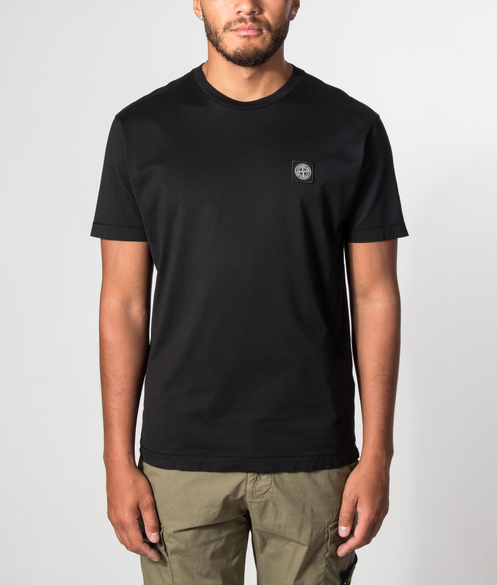 Stone Island Slim Fit 60/2 Cotton Jersey T-Shirt in Black at EQVVS Menswear.  Model front shot.