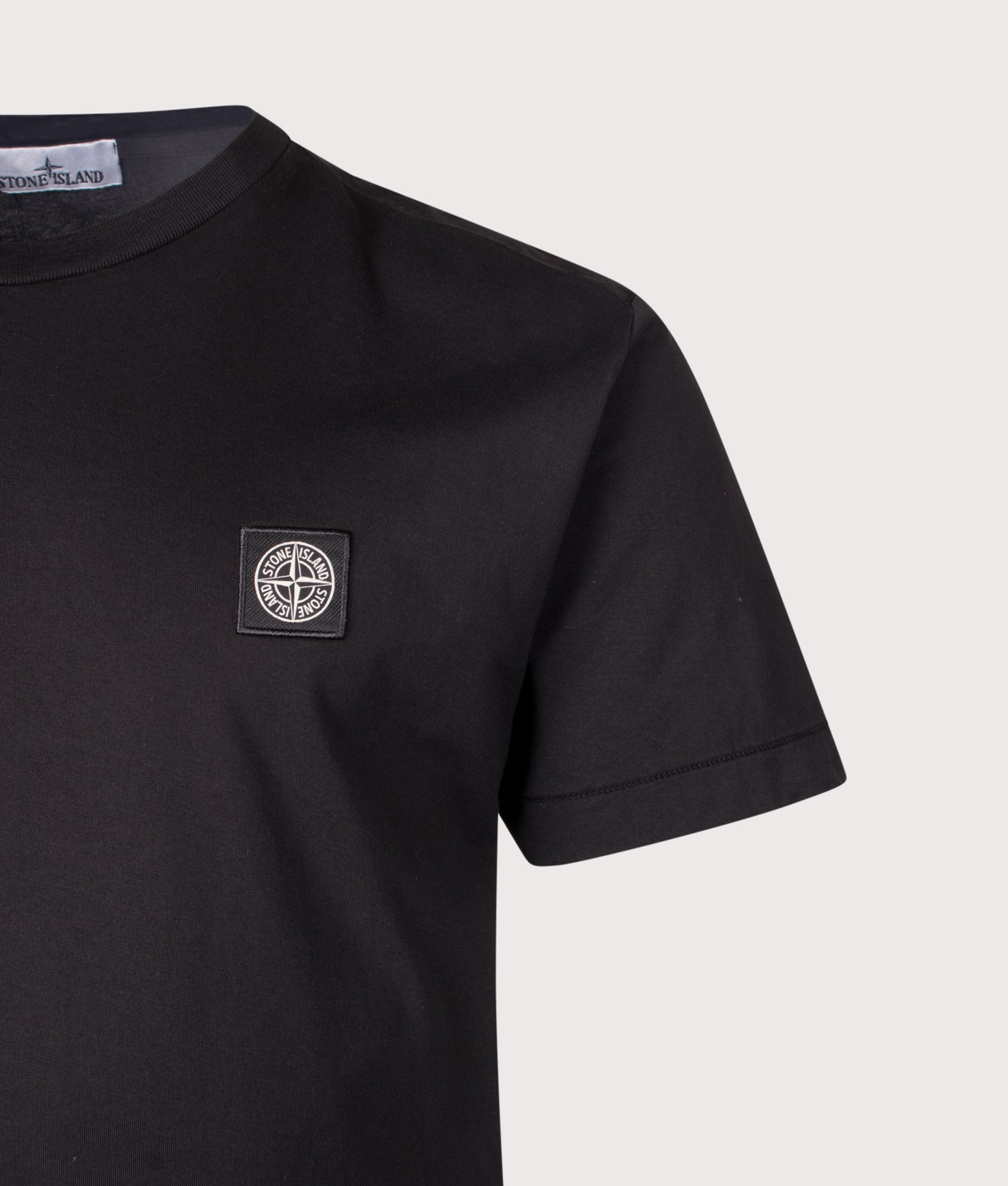 Stone Island Slim Fit 60/2 Cotton Jersey T-Shirt in Black at EQVVS Menswear. Detail shot.