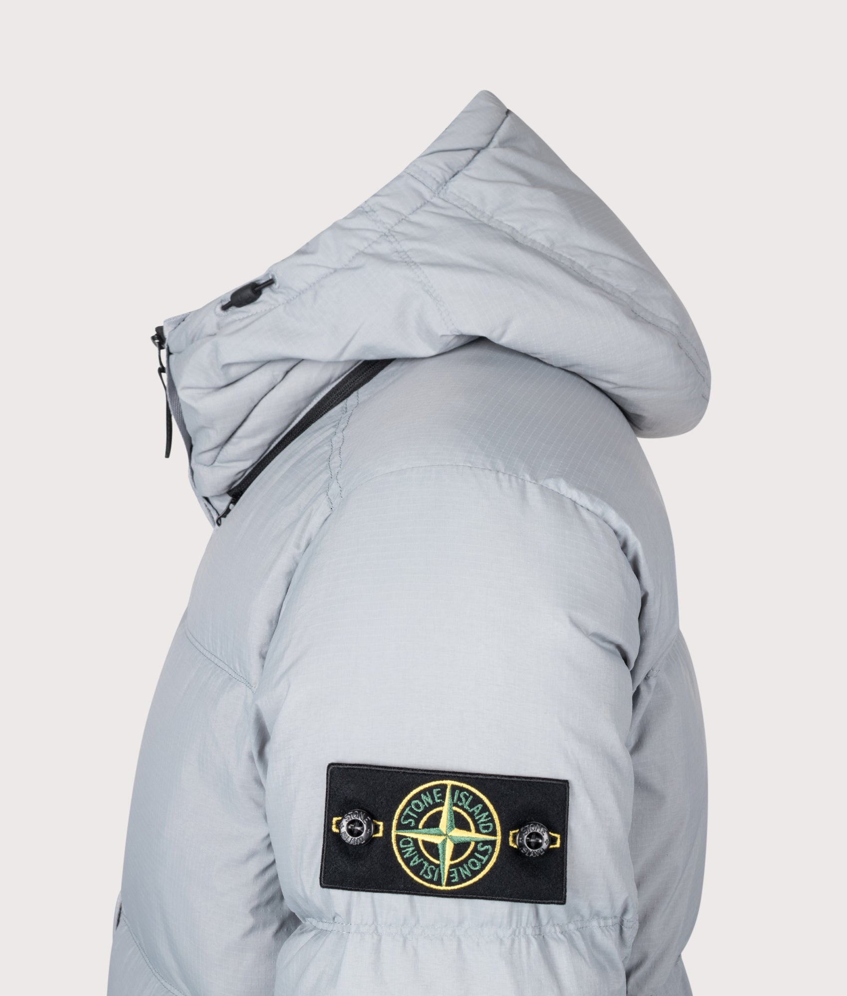 Stone Island Matt Ripstop Cordura® Advanced Fabrics Puffer Jacket in Ash Grey at EQVVS Menswear. Detail shot.