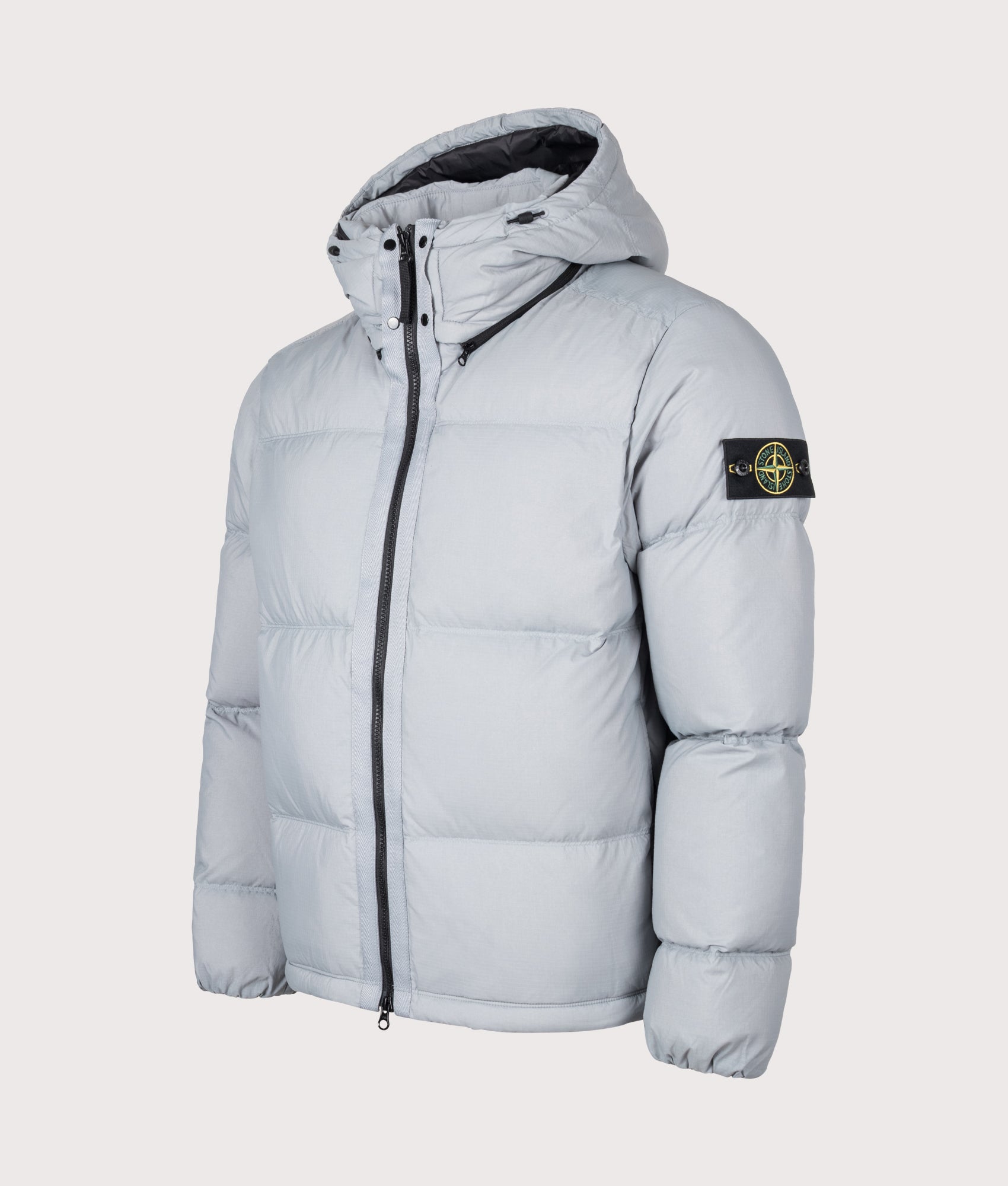 Stone Island Matt Ripstop Cordura® Advanced Fabrics Puffer Jacket in Ash Grey at EQVVS Menswear. Angled front shot.