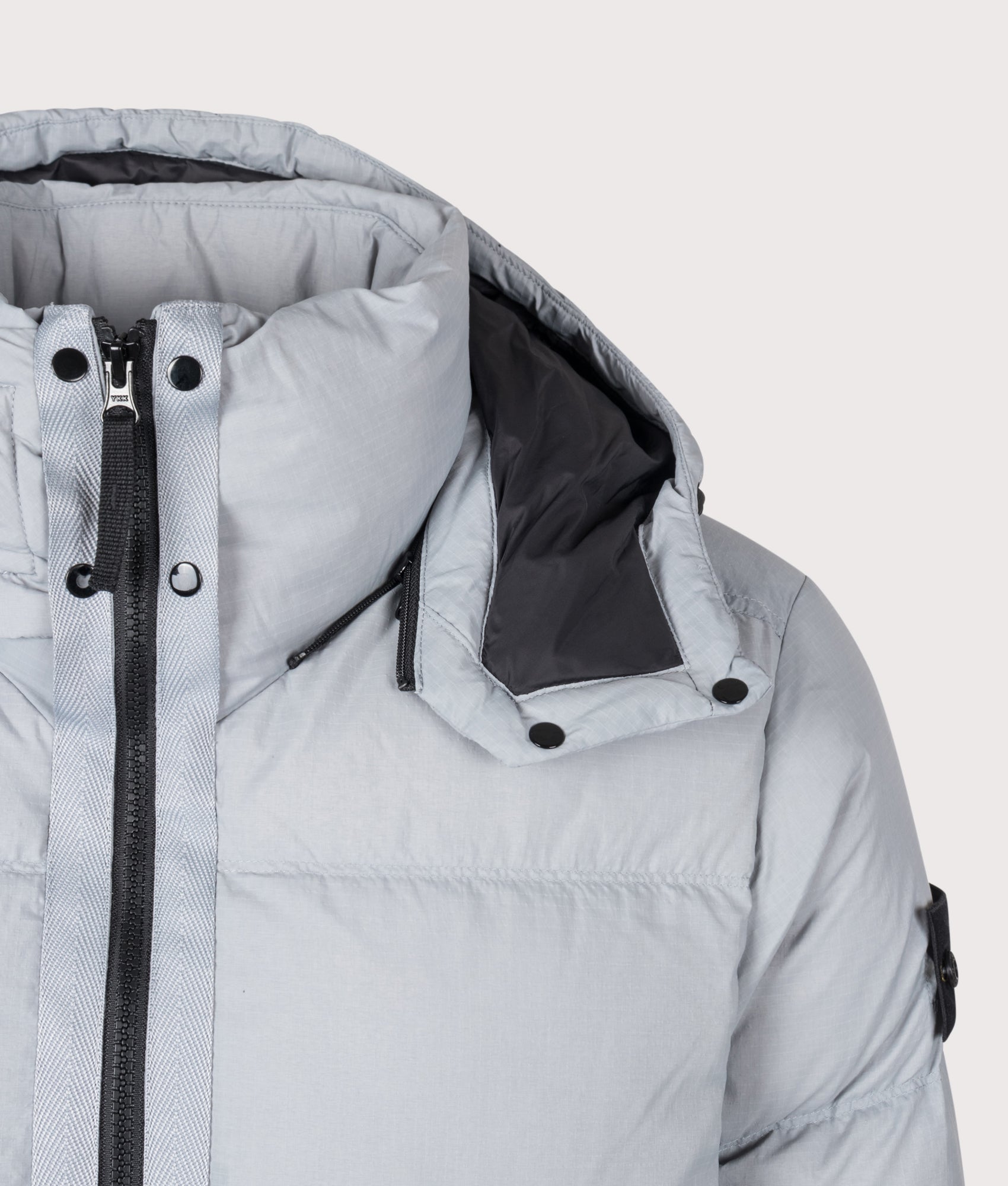 Stone Island Matt Ripstop Cordura® Advanced Fabrics Puffer Jacket in Ash Grey at EQVVS Menswear. Second detail shot.