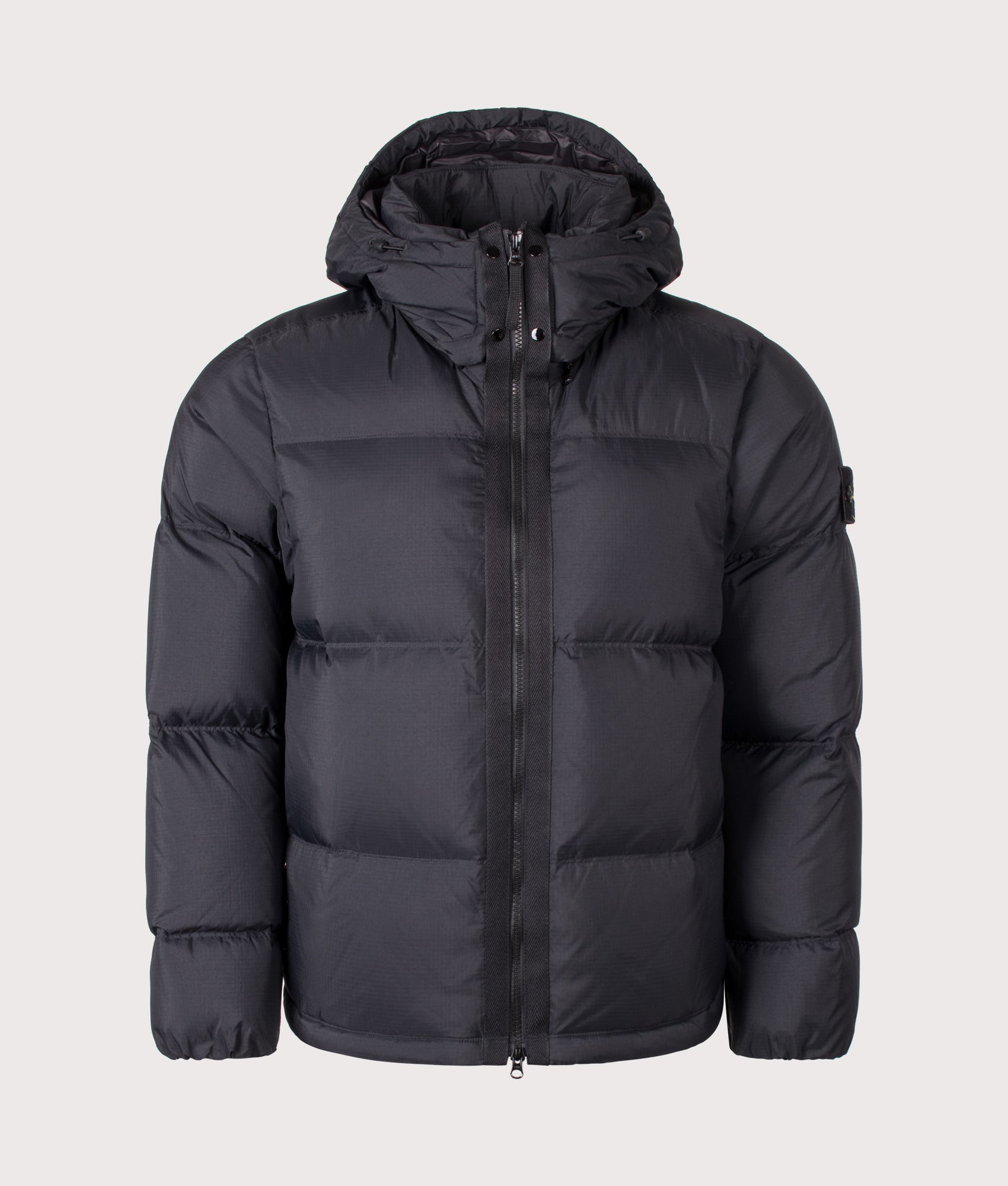 Stone Island Matt Ripstop Cordura® Advanced Fabrics Puffer Jacket in Black at EQVVS Menswear. Front shot.