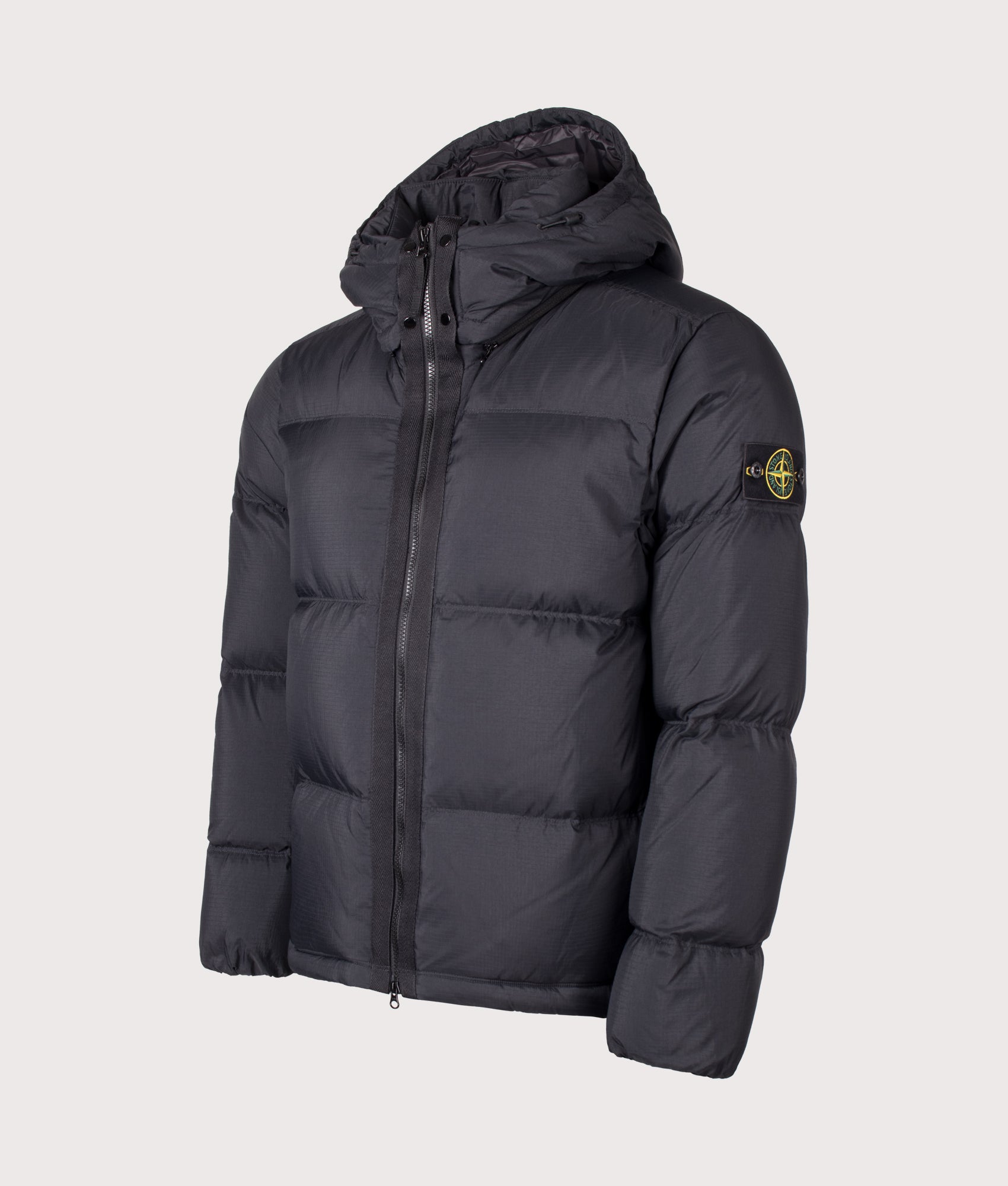 Stone Island Matt Ripstop Cordura® Advanced Fabrics Puffer Jacket in Black at EQVVS Menswear. Angled front shot.