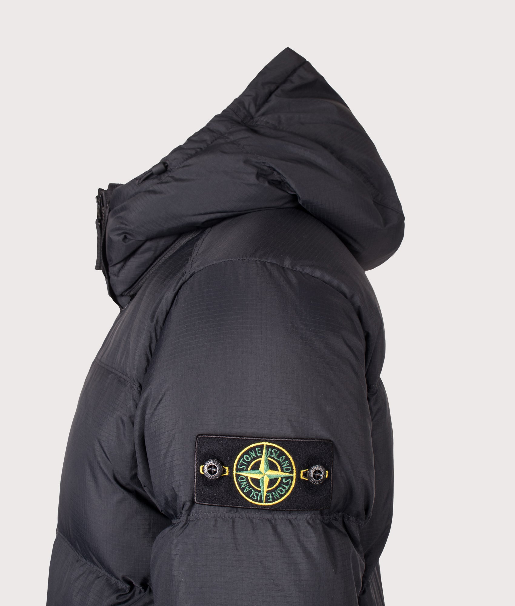 Stone Island Matt Ripstop Cordura® Advanced Fabrics Puffer Jacket in Black at EQVVS Menswear. Detail shot.