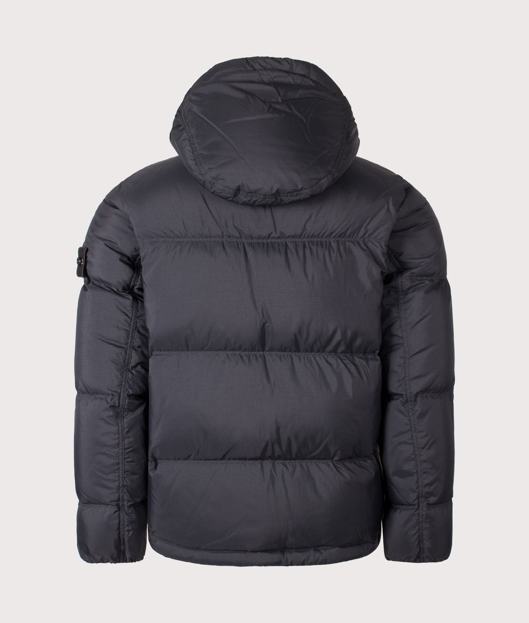 Stone Island Matt Ripstop Cordura® Advanced Fabrics Puffer Jacket in Black at EQVVS Menswear. Back shot.
